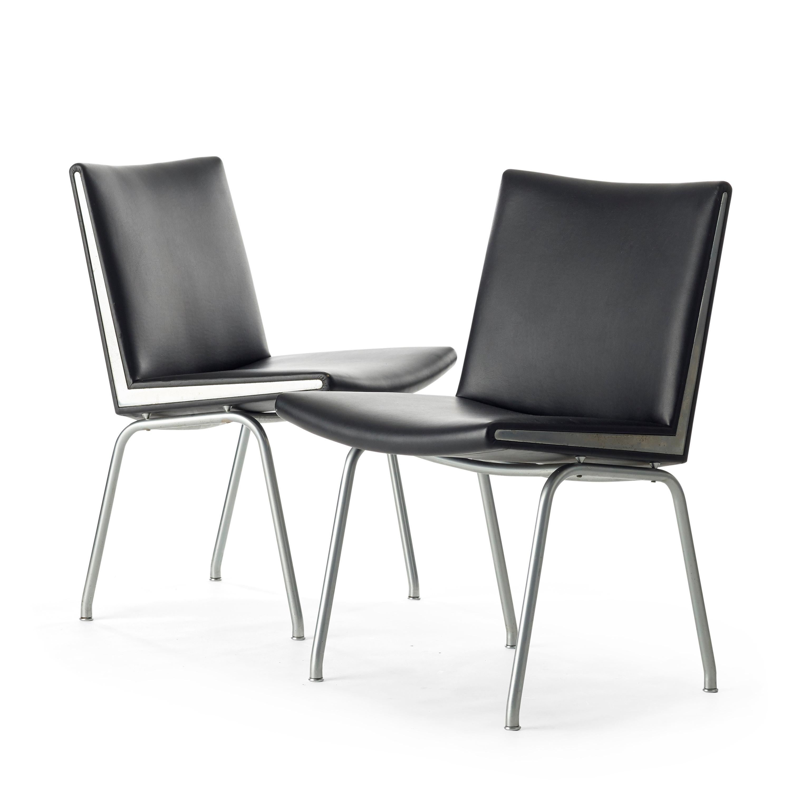 Set of two black vinyl and steel Kastrup chairs by Hans Wegner made by A.P. Stolen, circa 1950s

Also known as the Airport chair

Each measures 32.25” high, 19.75” wide and 19.75” deep, seat is 17.25” high

In good vintage condition with some