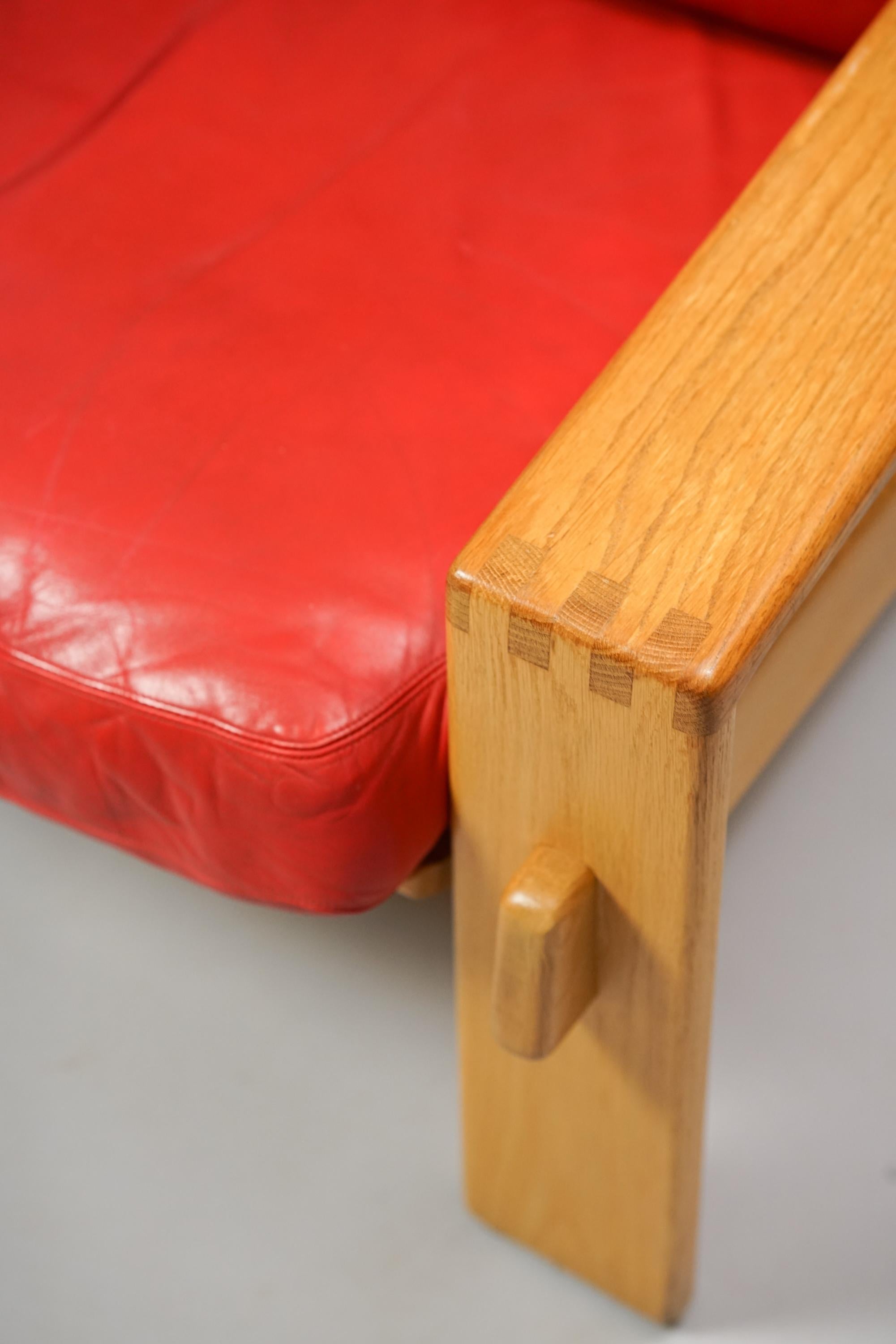 Set of two Bonanza armchairs by Esko Pajamies for Asko from the 1970s. Oak frame with original leather cushions. Good vintage condition, minor wear consistent with age and use. Classic piece of Finnish Mid-Century Modern design. The armchairs are