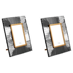 Juego de dos marcos de latón y cristal ahumado