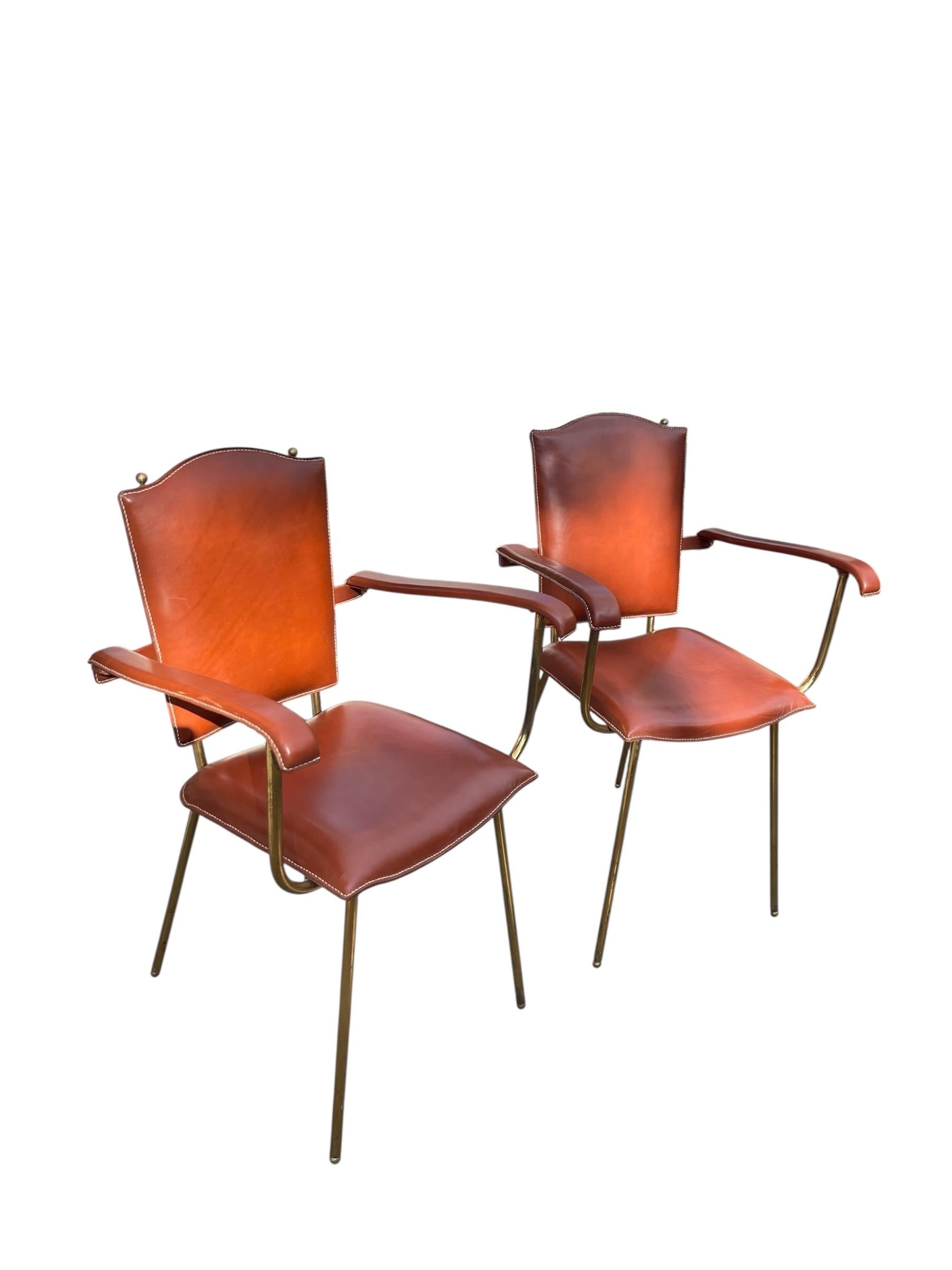 Very nice pair of 1950's Stitched leather bridge chairs by Jacques Adnet
Possibility of a second pair to make a set of four
