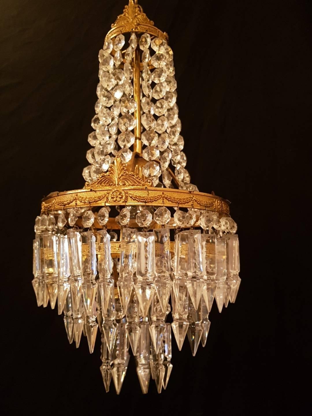 Set of two bronze chandeliers in sac a perle style.

This is just one of our large collection chandeliers. Besides the old and antique chandeliers we have beautiful series of new large chandeliers in the Marie Therese style.