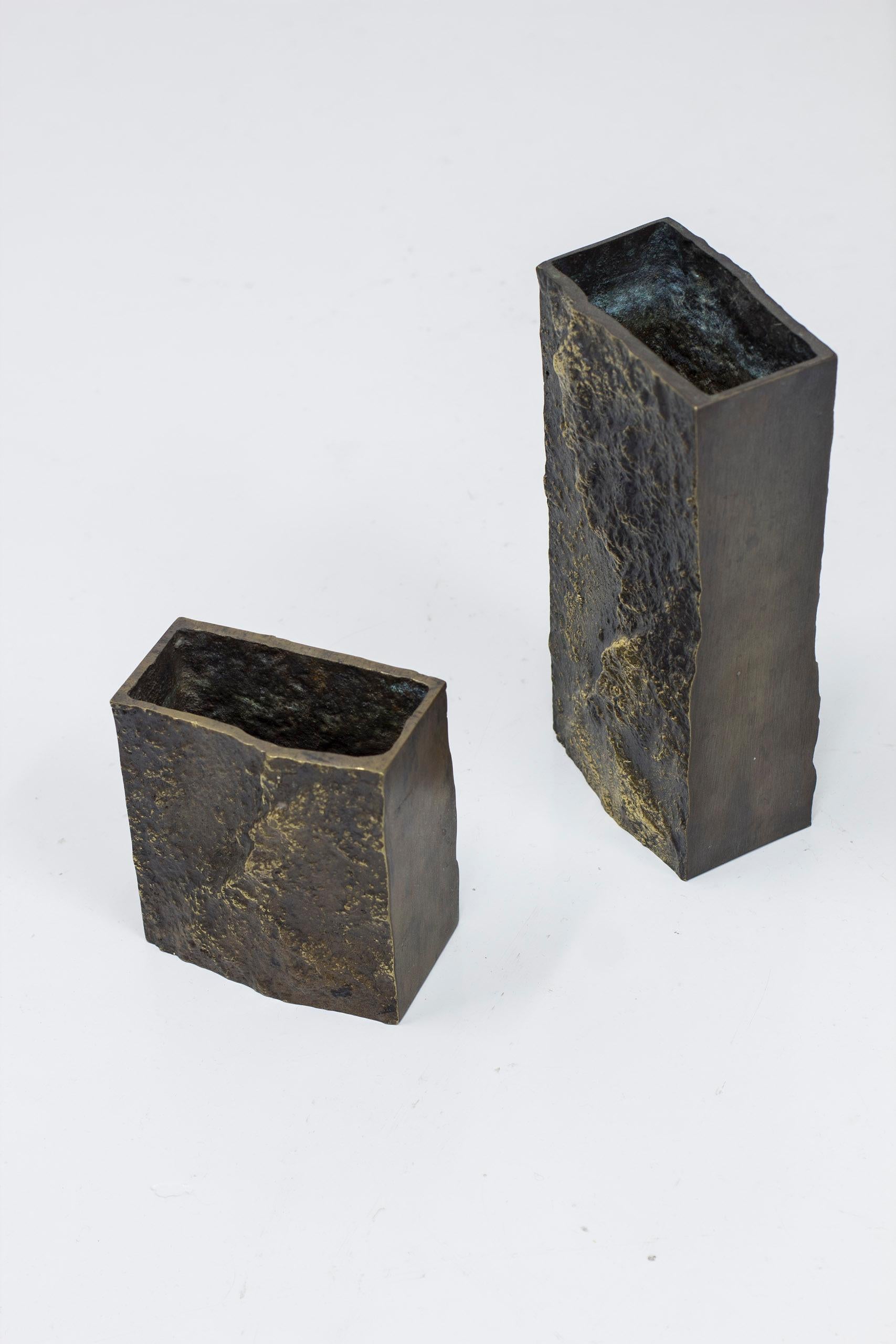 Brutalist bronze vases designed by Kaj Blomqvist. Produced in Finland by Rakennusvaline during the 1960s. Made from solid cast bronze. Partly polished.  Very good vintage condition with light age related wear/patina.

 

Price for the set of two