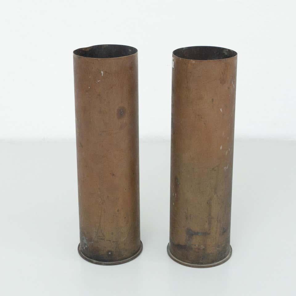 Set of two bronze vases.
By unknown manufacturer from Spain, circa 1930.
Previous use was bullets.

In original condition, with minor wear consistent with age and use, preserving a beautiful patina.

Material:
Bronze

Dimensions:
 Ø 10.5