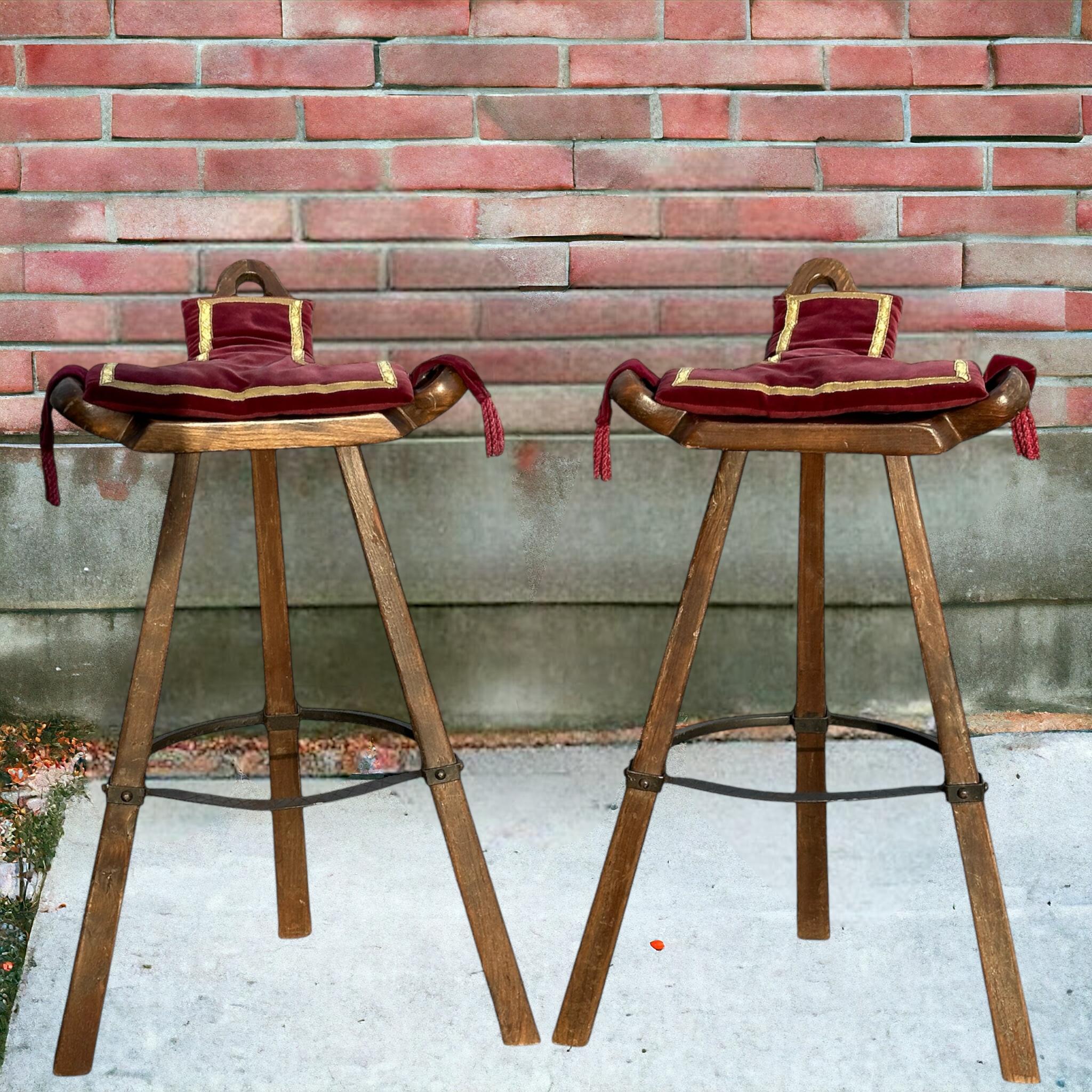 A gorgeous set of Brutalist bar stools. Set of two 'Brutalist' or 'Marbella' bar stools, in wood and metal, Spain, 1970s. A curved T-shape with three handles. The curved form makes sure the stool has a stabile seat, emphasized by the metal ring as