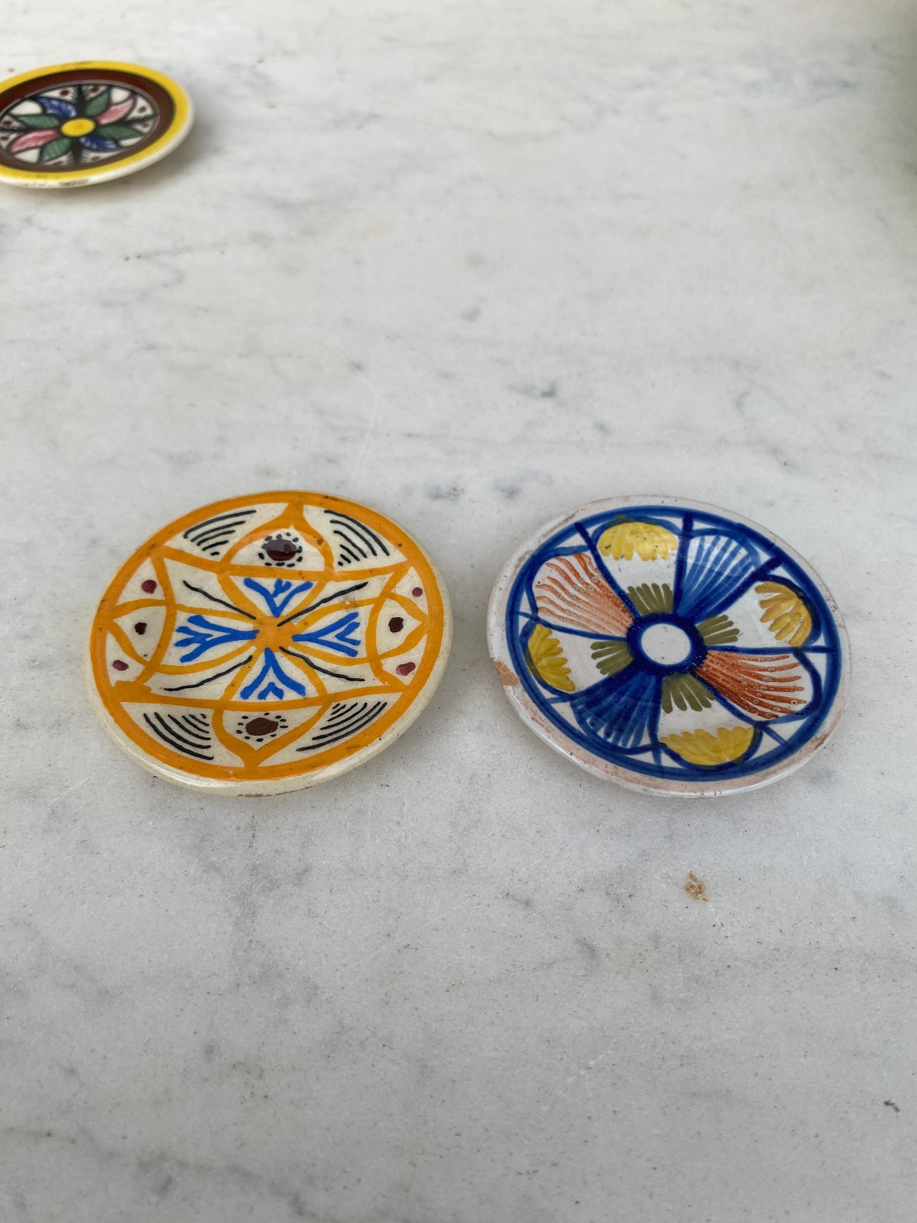 Set of 2 colorful butter pats Henriot Quimper, circa 1920.
Geometrical pattern all four differents.