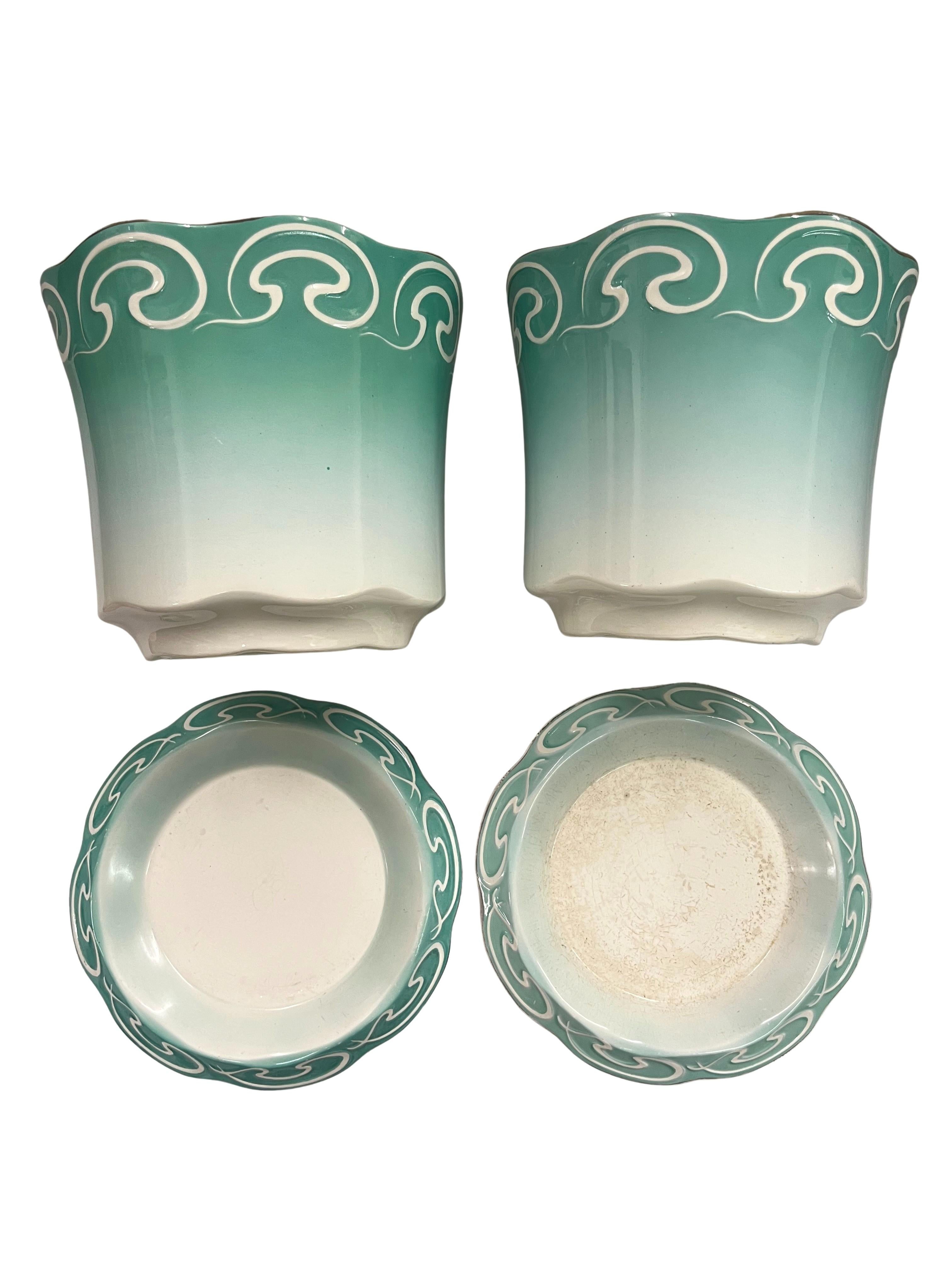 Set of two flower pots, jardinieres, Art Nouveau, circa 1900, from the famous Societe Ceramique Maestricht, Netherlands. 

Charming set of two flower pots, made by the well known manufacturer Societe Ceramique Maestricht, in the Art Nouveau