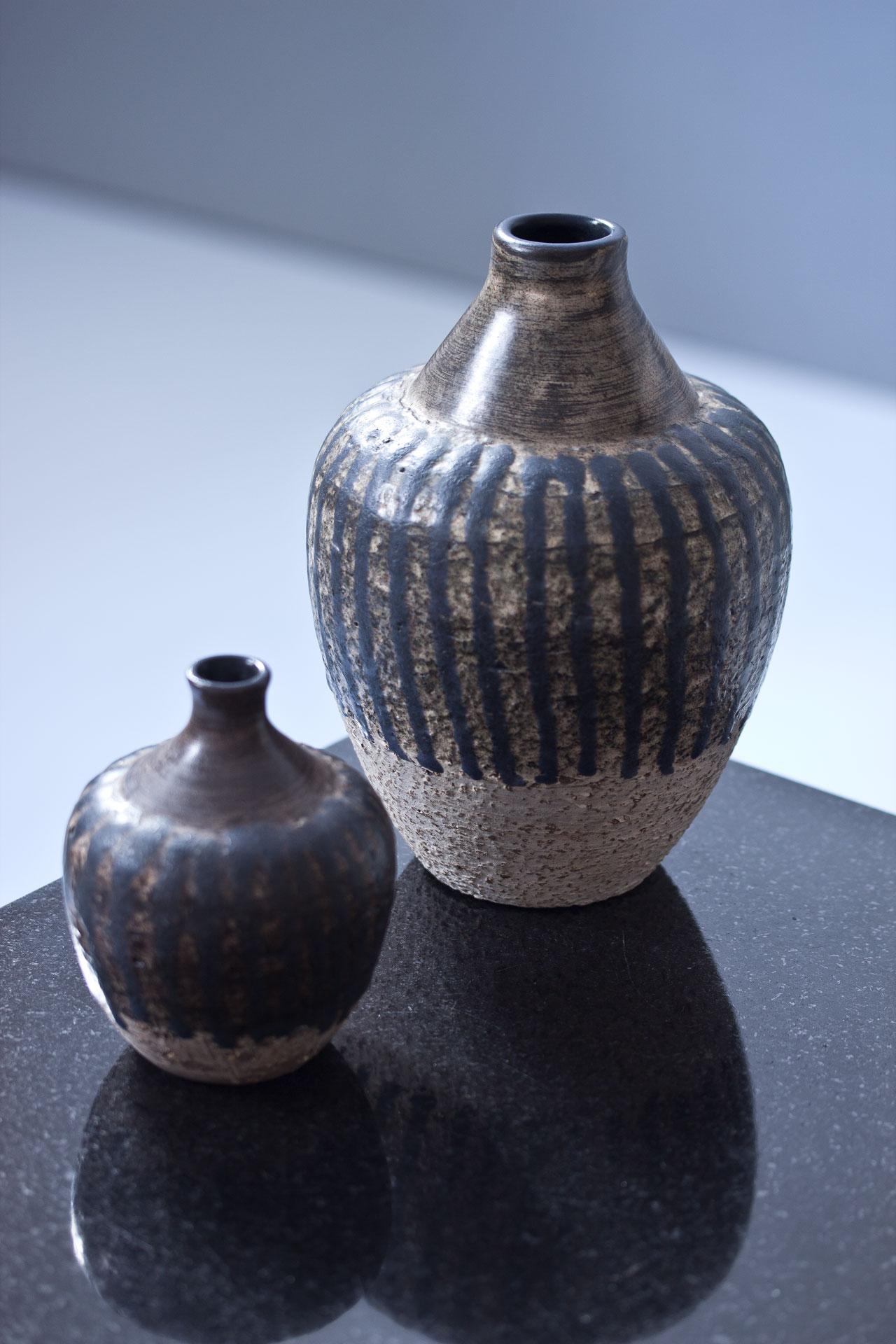 Set of two vases from the Kalebass (Gourd) series designed by Mari Simmulson. Manufactured by Upsala-Ekeby in Sweden in 1967. Made. from partially chamotted stoneware. Signed on the bottom and labeled.