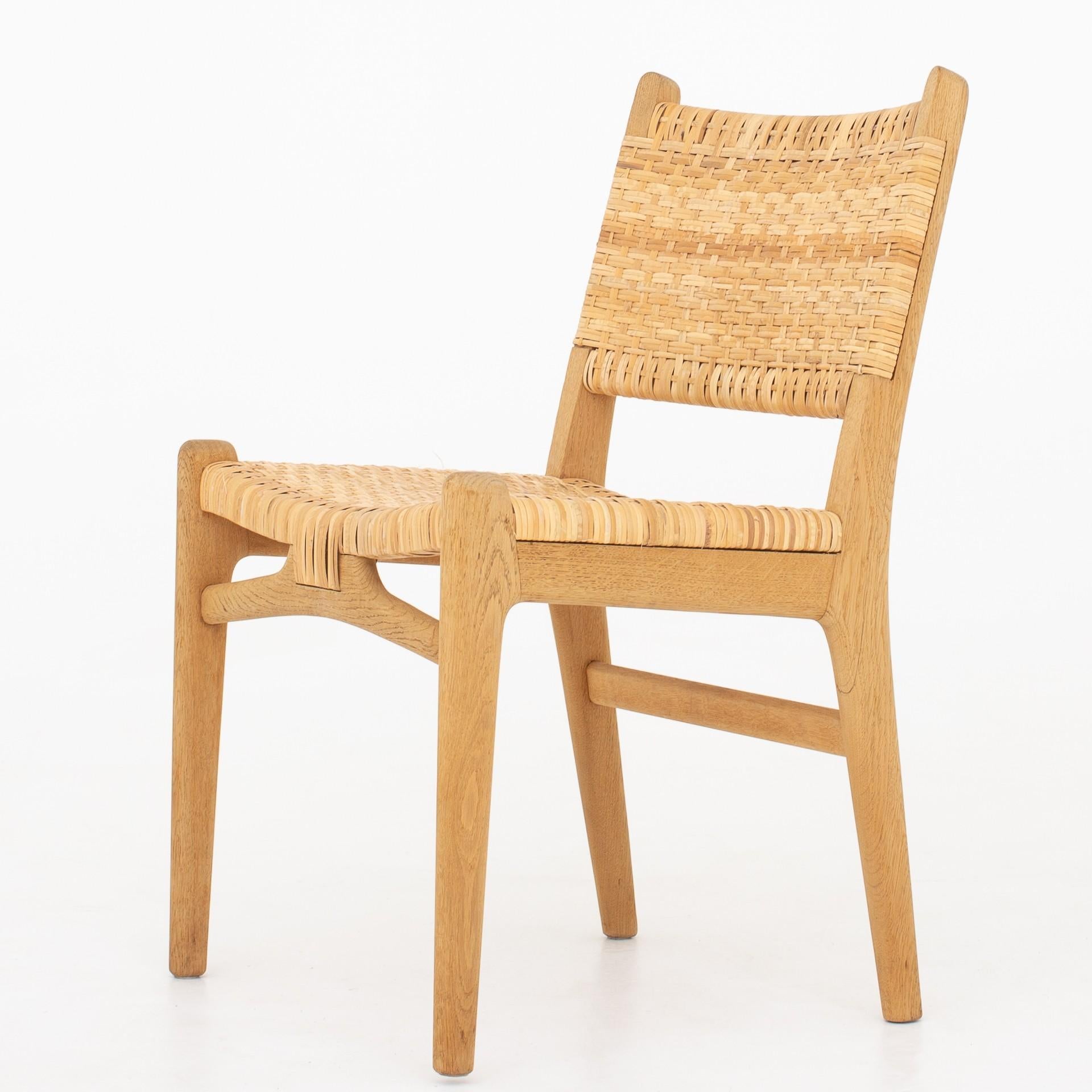 Set of two CH 31. Chairs in patinated oak and cane webbing. Maker Carl Hansen.