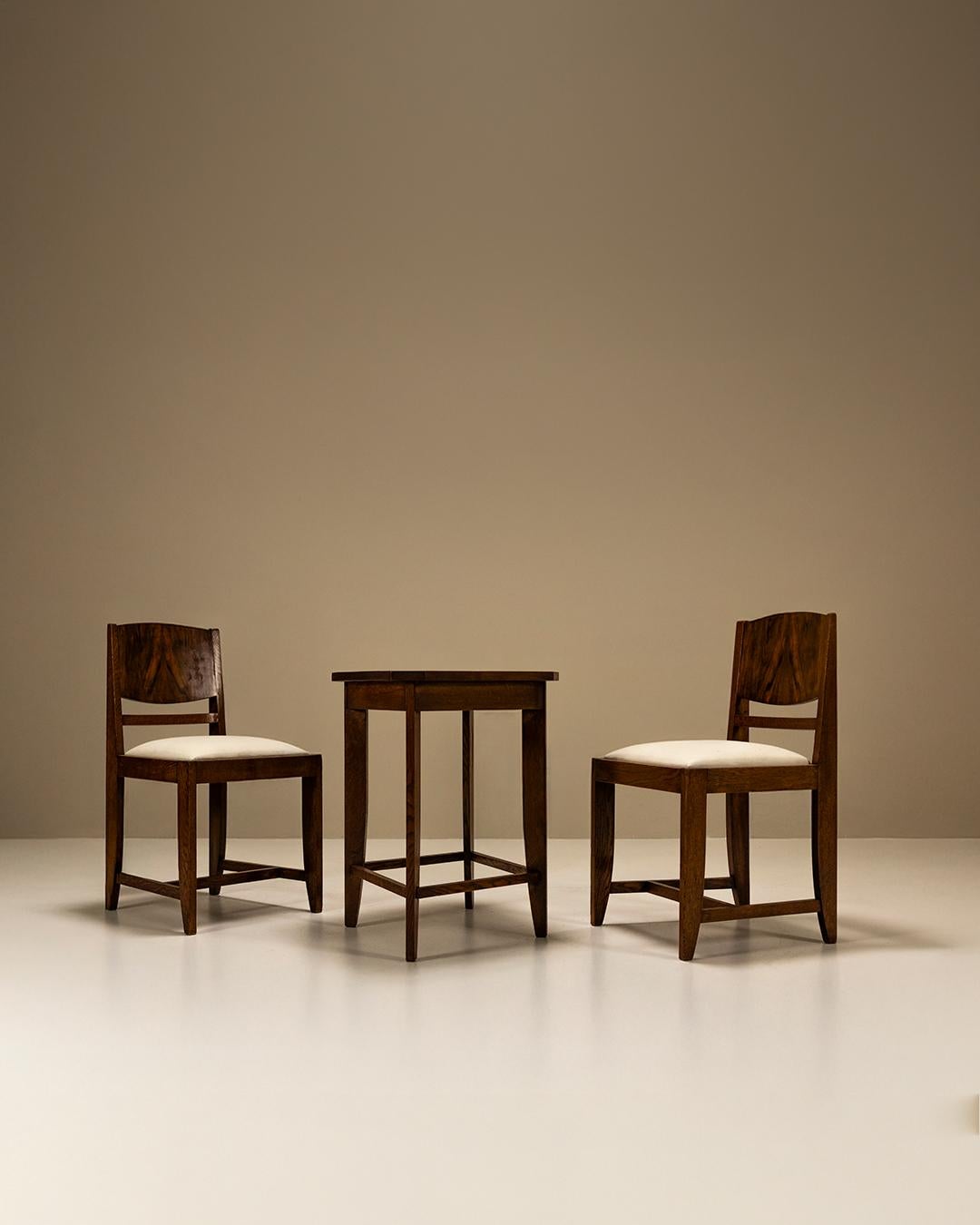 This refined side table set with two matching chairs, produced by the Dutch company 'Pander', reflects the studio’s long-standing appreciation for functional, well-crafted design. Known for their sophisticated approach to interior furnishings,