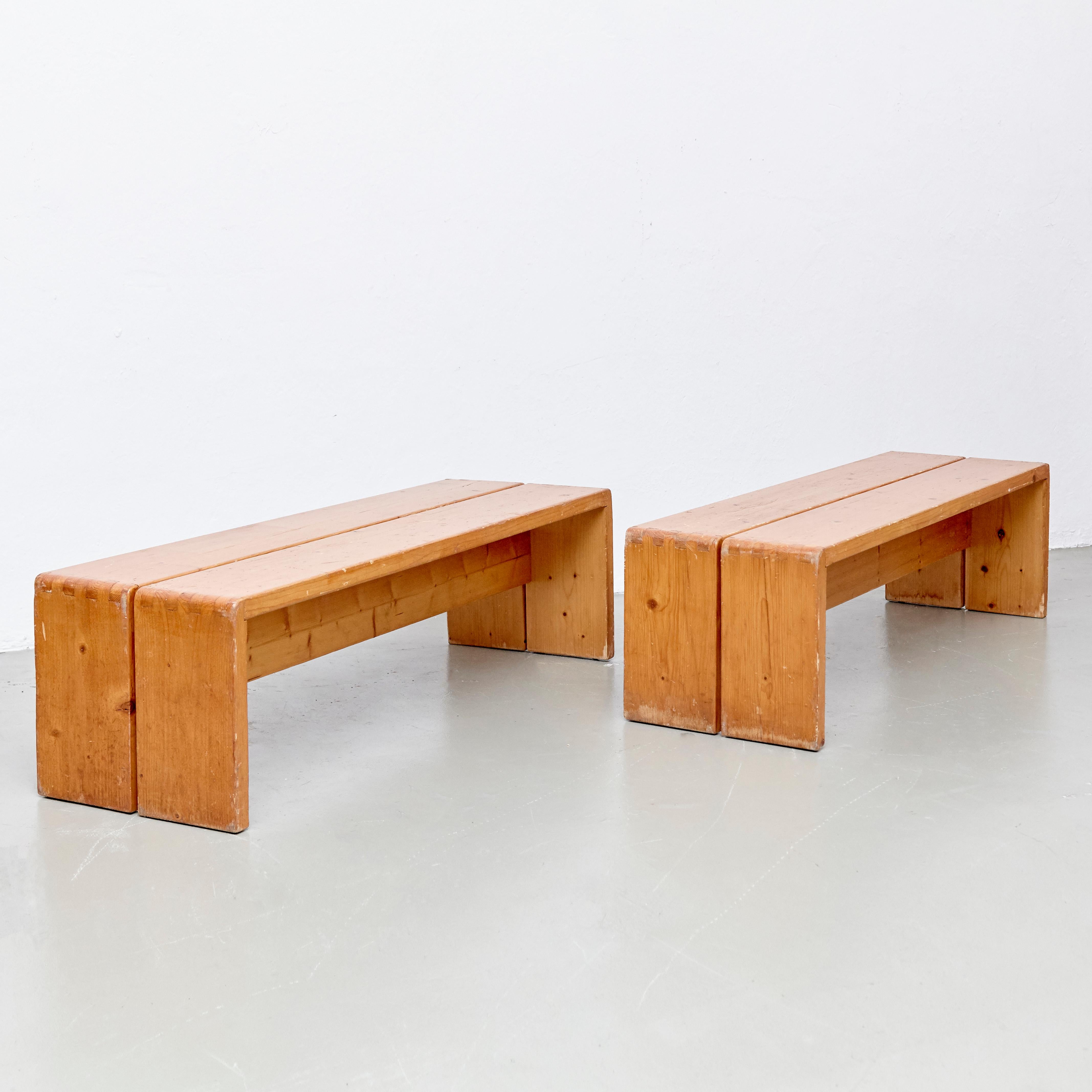 Benches designed by Charlotte Perriand for Les Arcs ski resort circa 1960, manufactured in France.
Pinewood.

In original condition, with wear consistent with age and use, preserving a beautiful patina.

Charlotte Perriand (1903-1999). She was