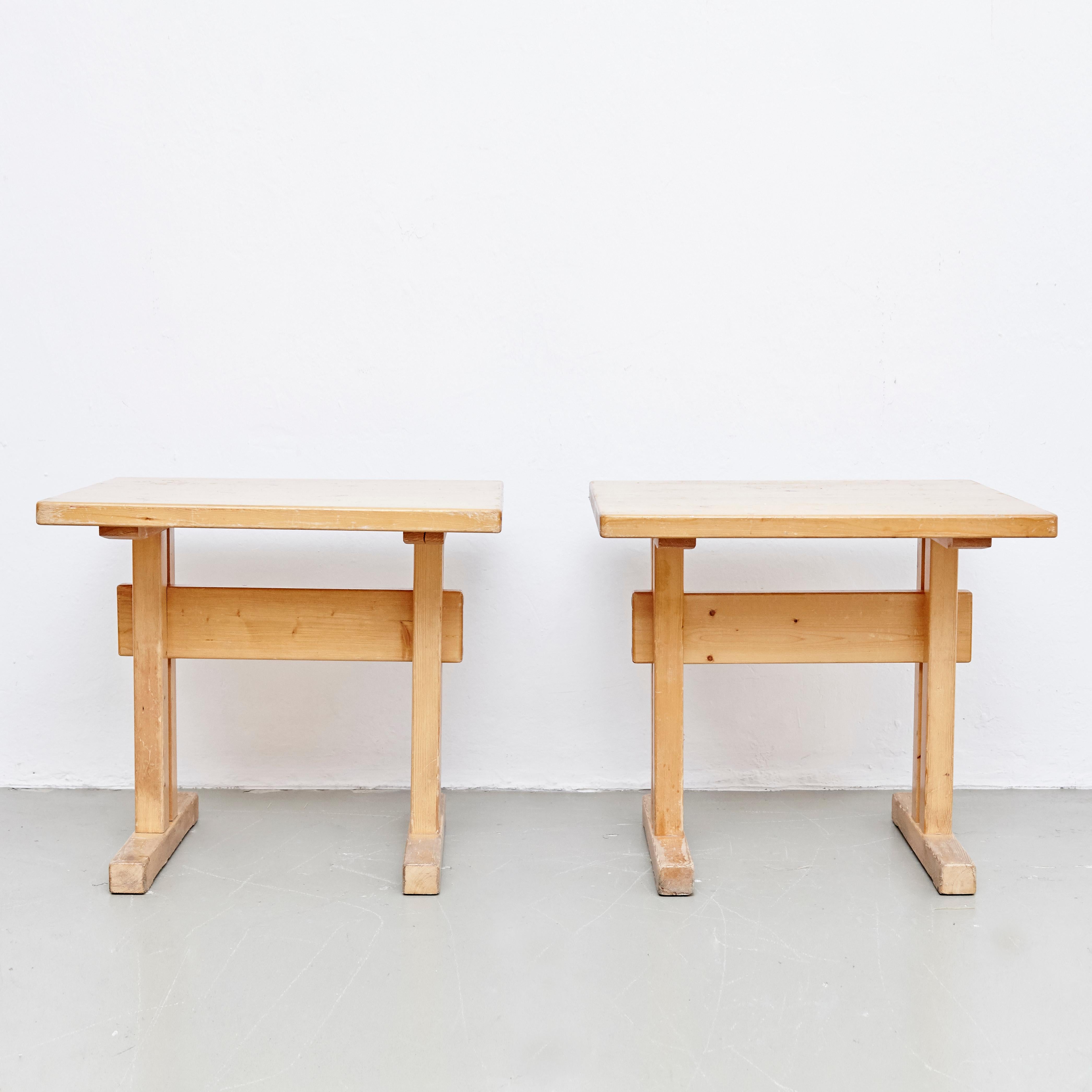 Two tables designed by Charlotte Perriand for Les Arcs ski resort circa 1960, manufactured in France.
Pinewood.

In original condition, with wear consistent with age and use, preserving a beautiful patina.

Each table: 80 W x 67.5 D x 71 H