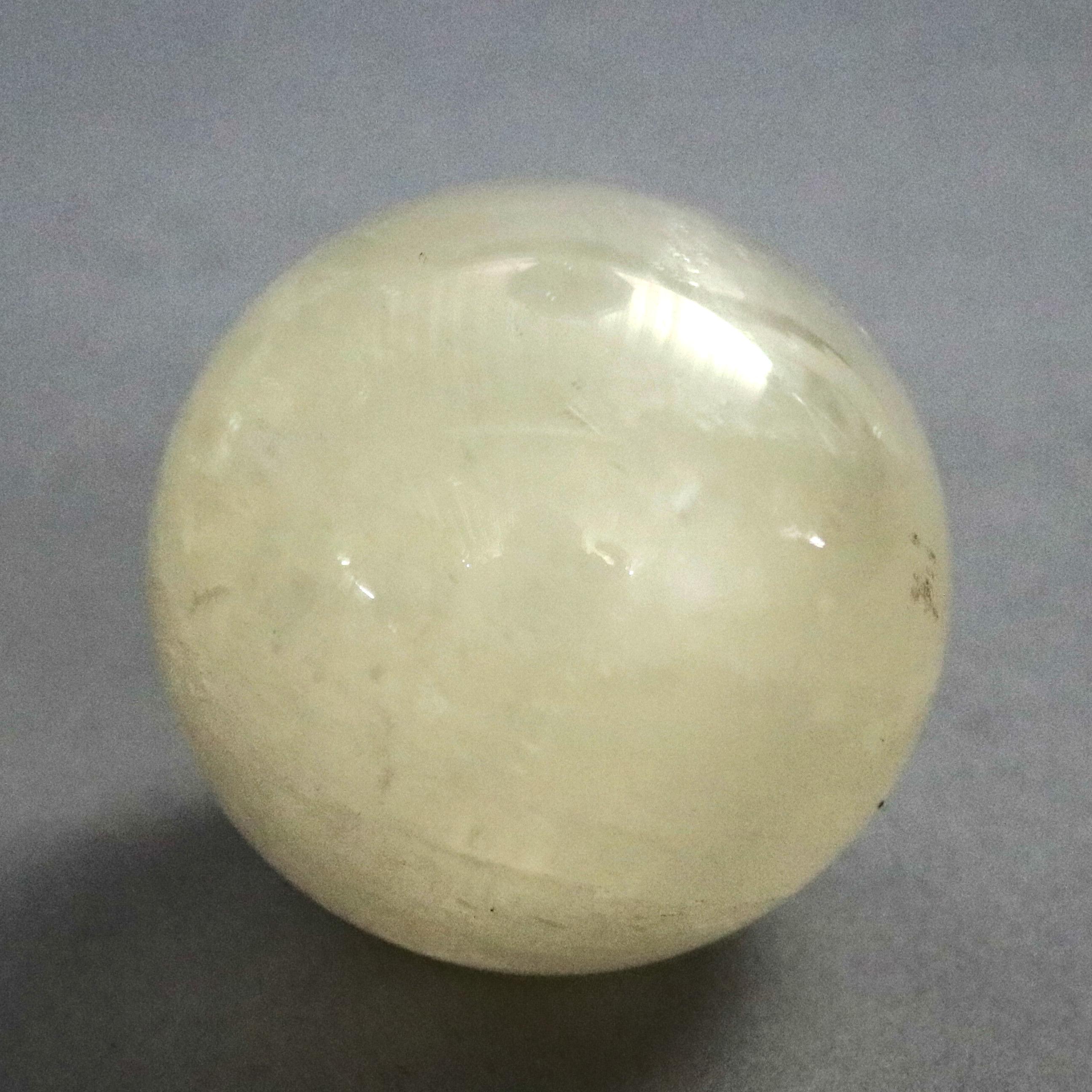 A set of two Chinese jade green and white onyx balls, 20th century

Measures- Jade- 2.13