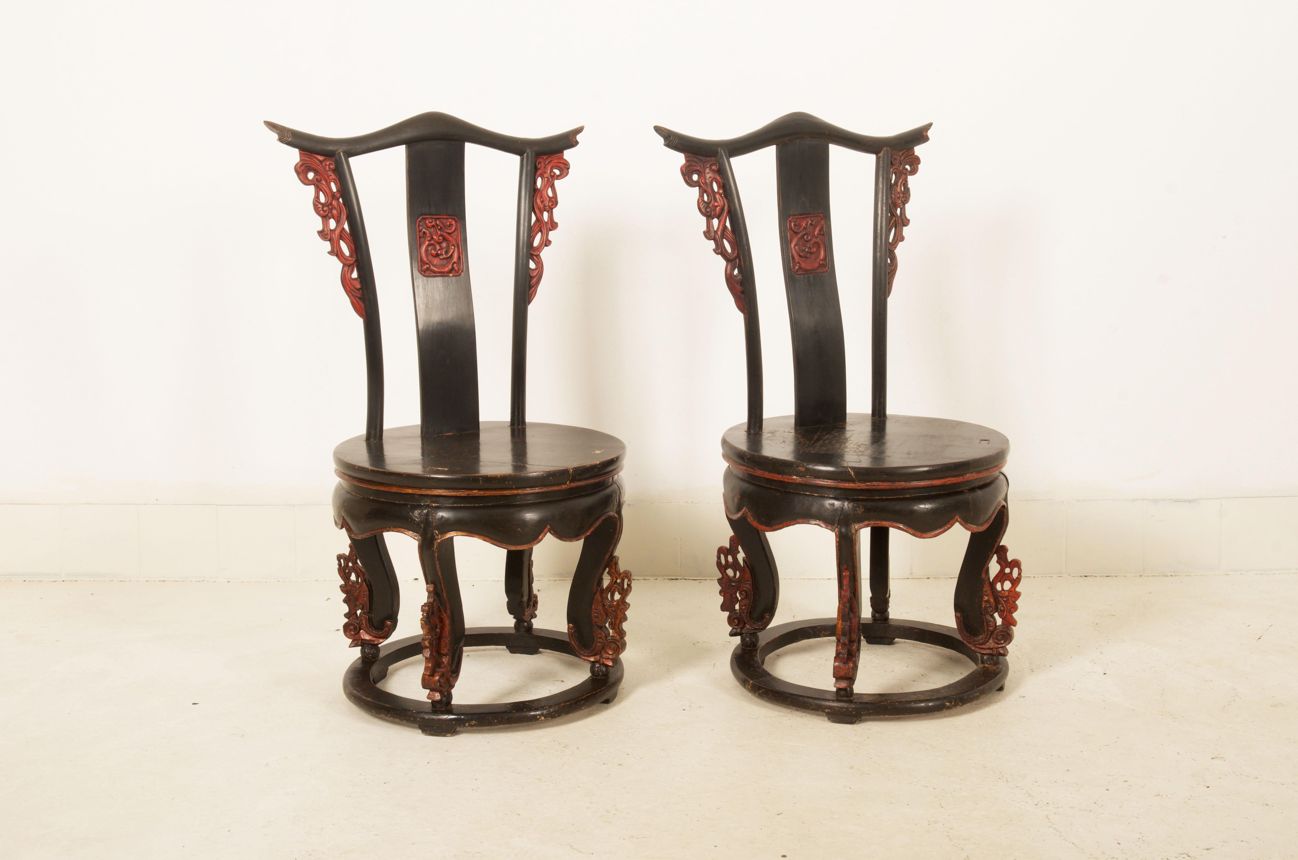 Hardwood frame black and red painted with some ornaments on the backrest and the legs. Made in China in the middle of the 19th century. Price for both.