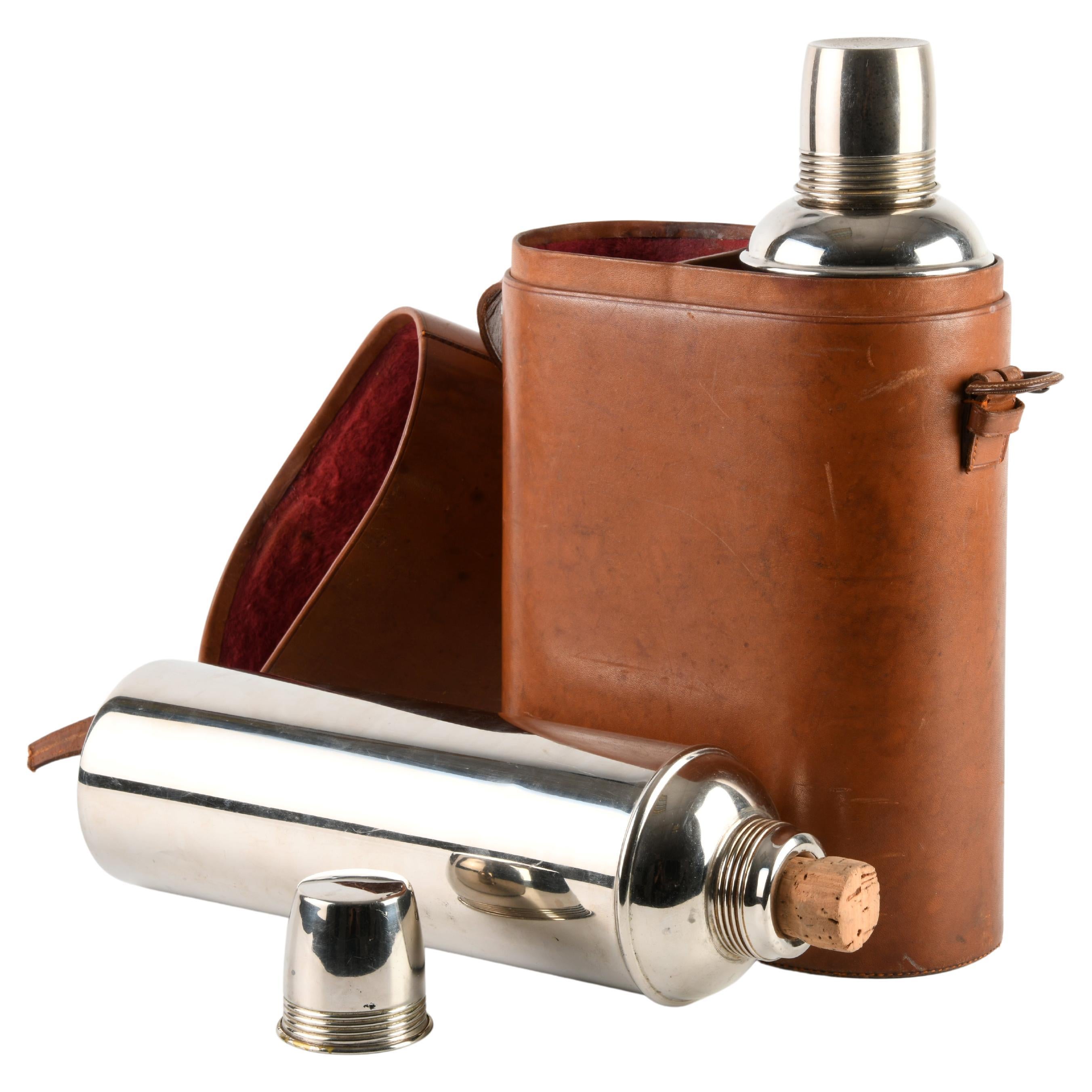 Set of two chrome-plated steel Thermos flasks, in a velvet-lined leather case