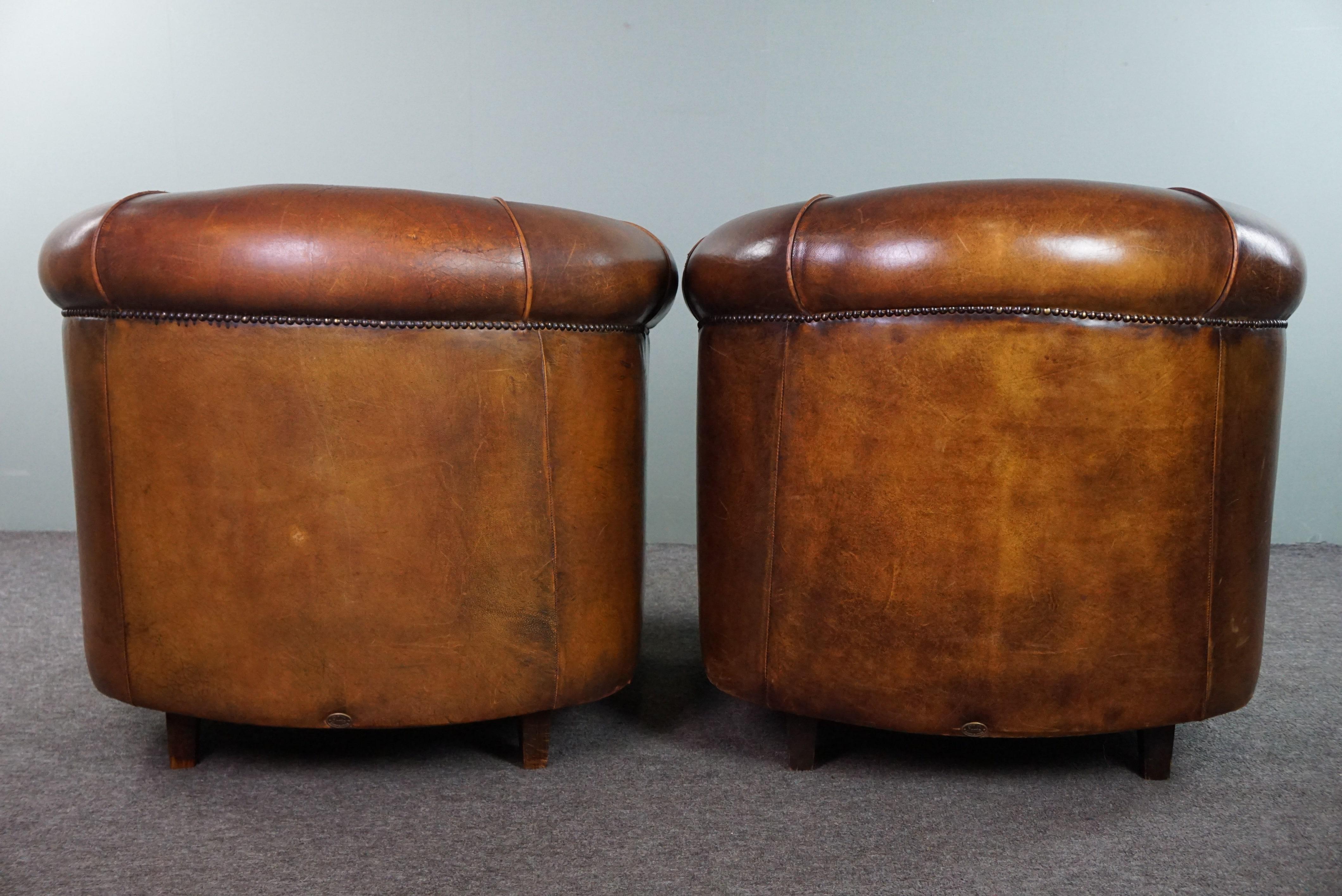 Romantic Set of two club armchairs made of sheep leather in a beautiful warm dark color For Sale