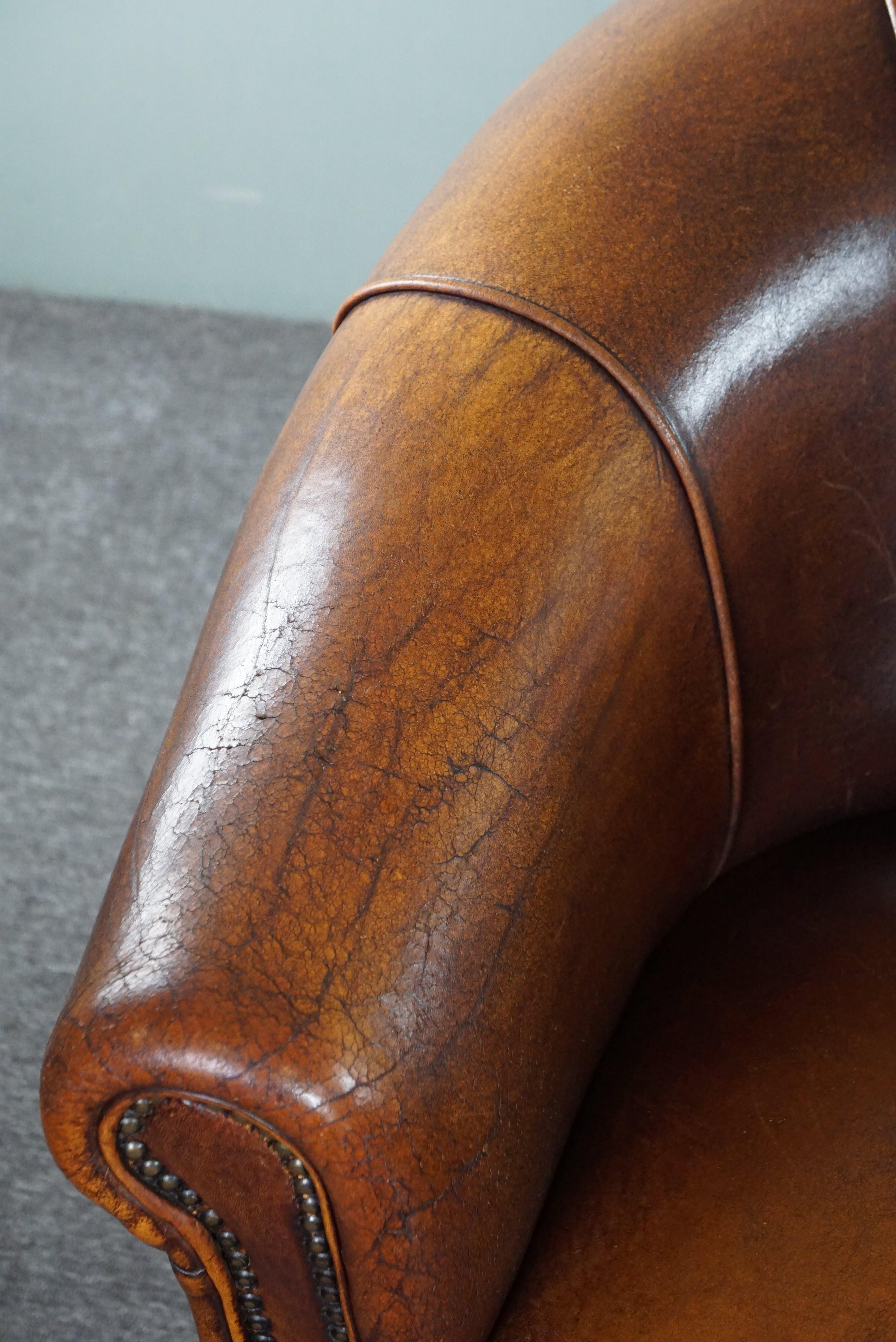 Late 20th Century Set of two club armchairs made of sheep leather in a beautiful warm dark color For Sale