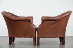 Set of two cognac-coloured Chesterfield club armchairs