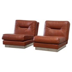 Set of two cognac leather lounge chairs by Jacques Charpentier