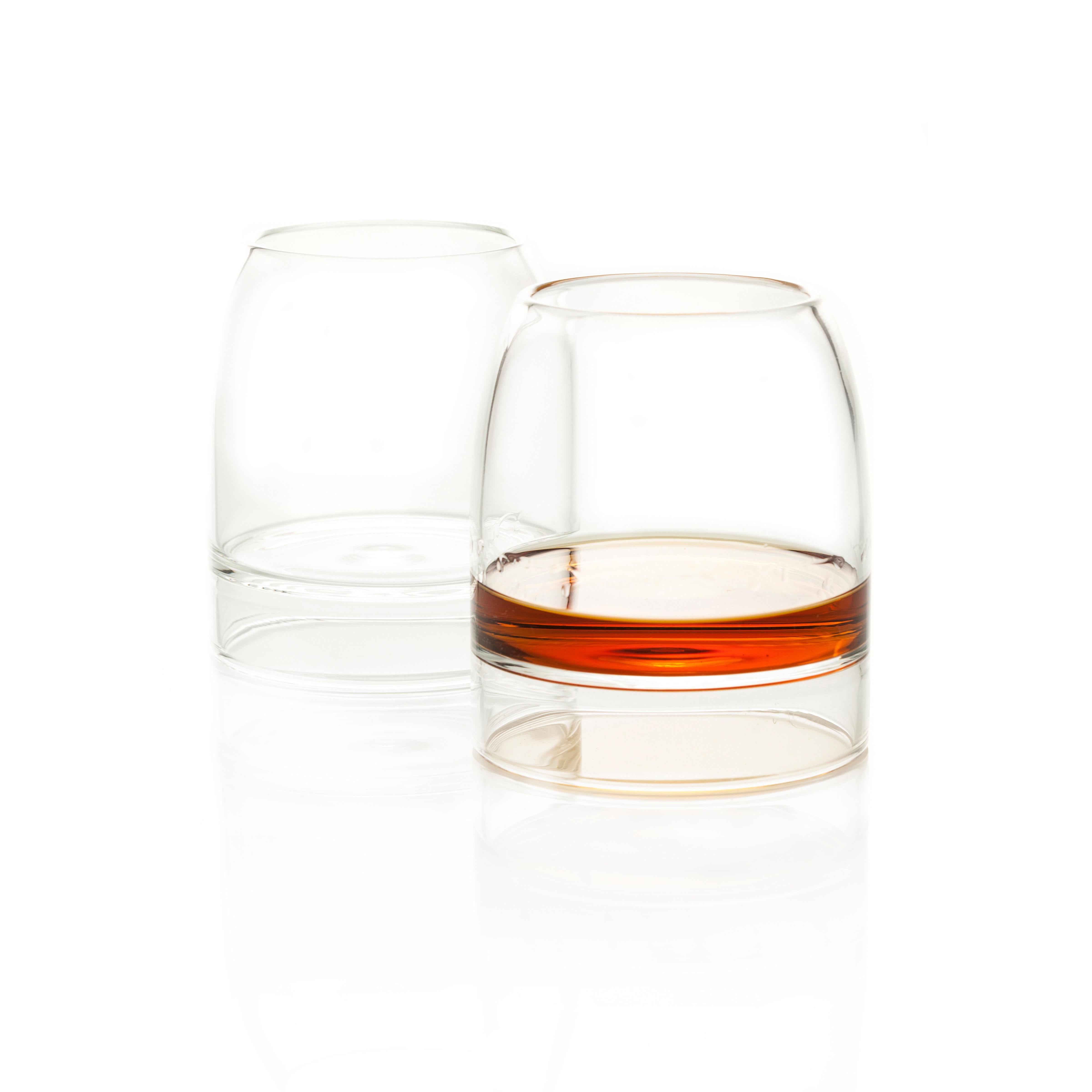 Rare whiskey glasses, set of two.

Inspired by the pleasures of fine whisky, the rare whisky glasses concentrate the aroma, enhancing the flavor through its design. Each glass is individually hand-formed by master glassblowers from the finest