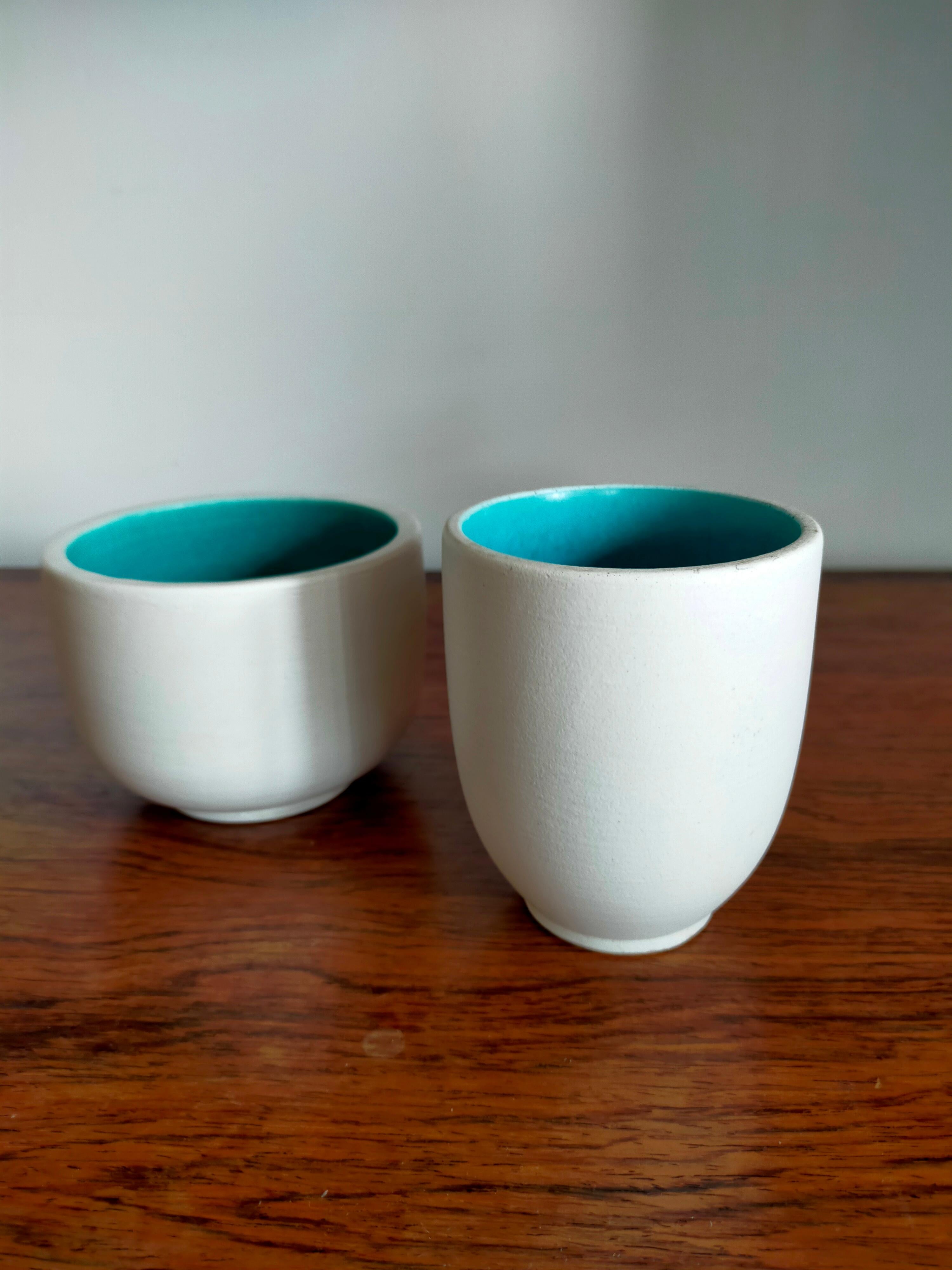 Set of cream glazed ceramic vide poche with turquoise blue interior.
Embossed Signature Kéramos Sèvres under the Base.
The small one is 9,4 x 11,2 cm
The tall one is 12,4 x 11,2 cm.
