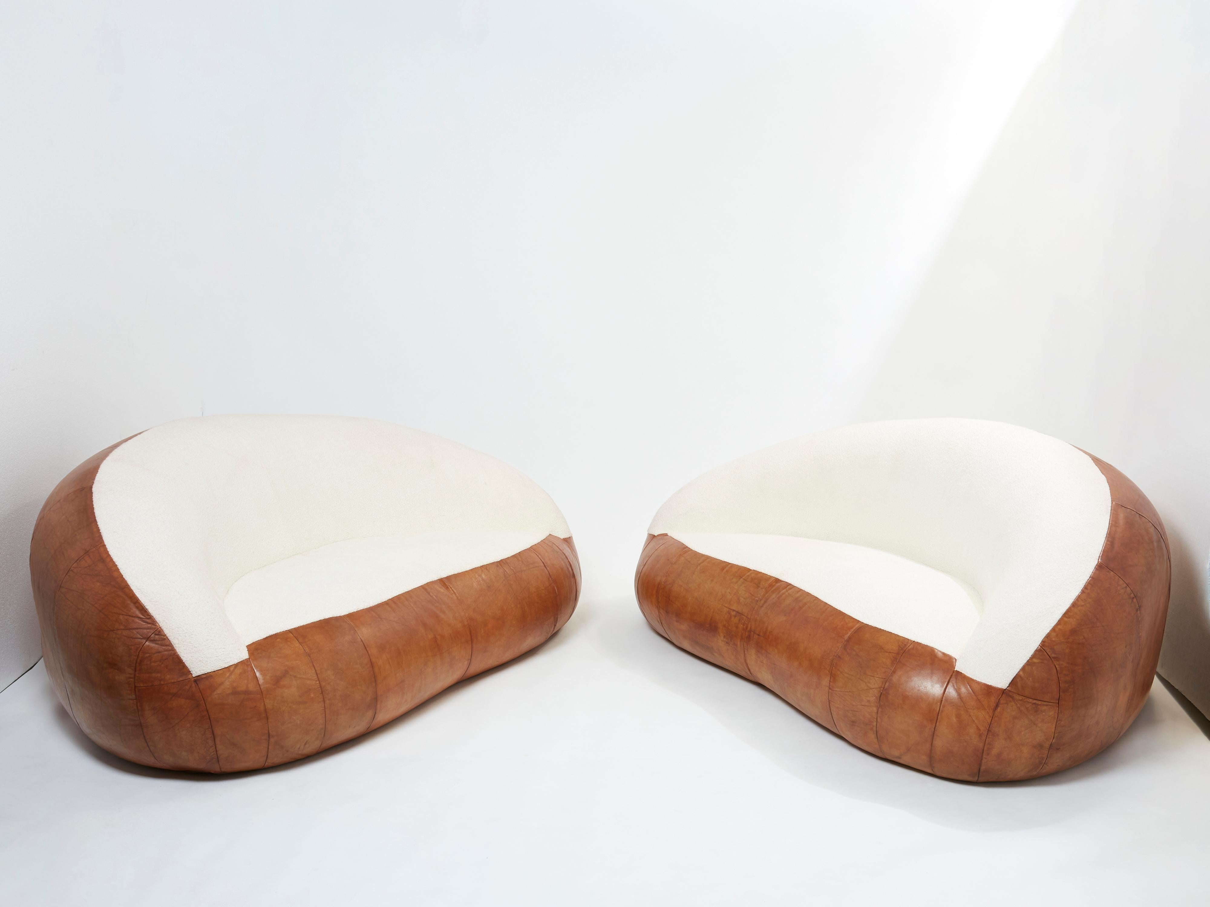 Rare set of two small croissant sofas by Raphaël Raffel for Maison Honoré Paris made in the mid 1970s. The sofas have been fully restored, keeping the original cognac leather, with the seat and seat back newly upholstered with a beautiful wool