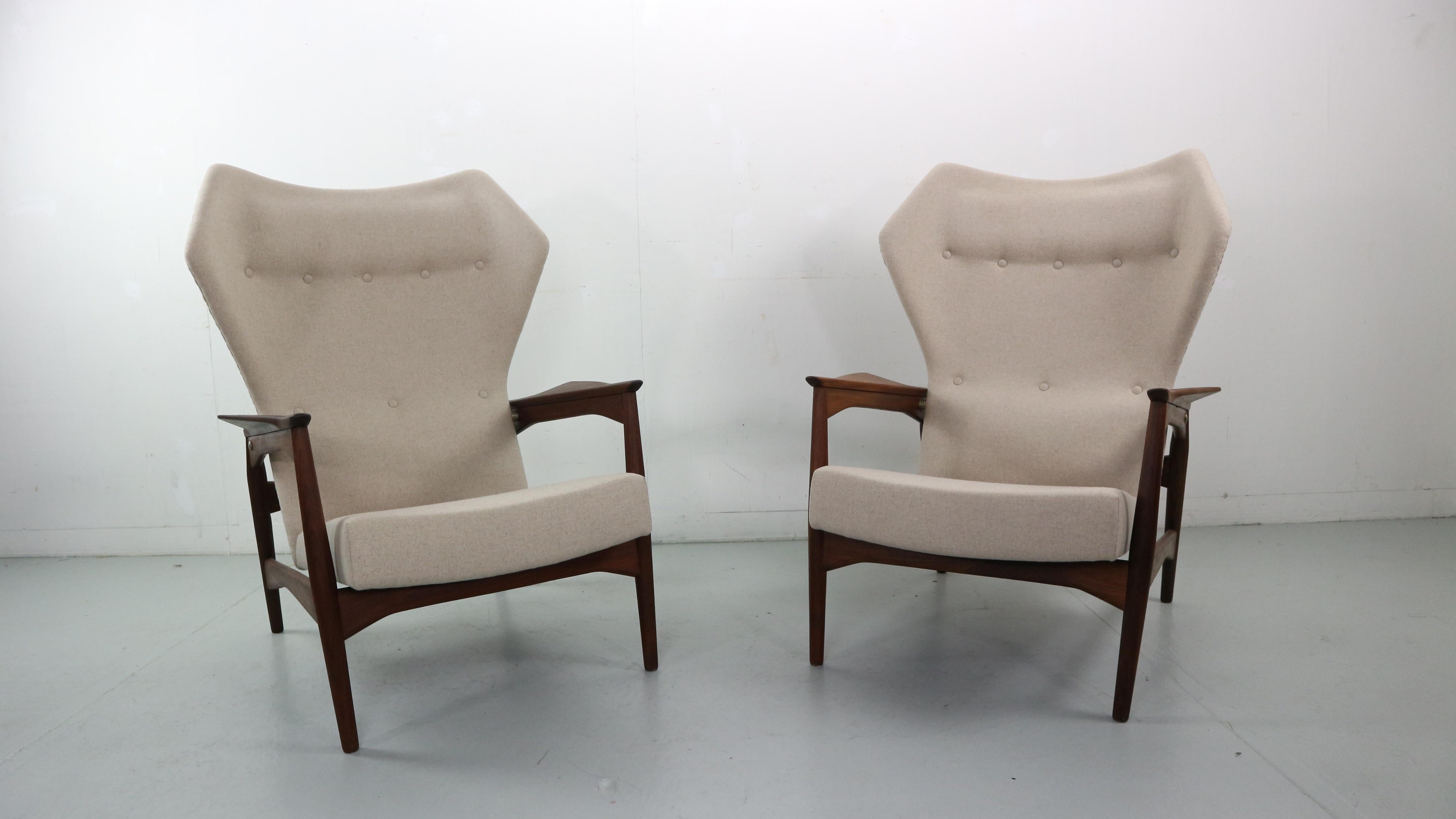 Set of two wingback lounge chairs designed by Ib Kofod-Larsen in 1954. The chairs are reclinable and it can be adjusted in three positions, as seen in the pictures. The chairs have been reupholstered in a natural wool (shiitake) beige color, perfect