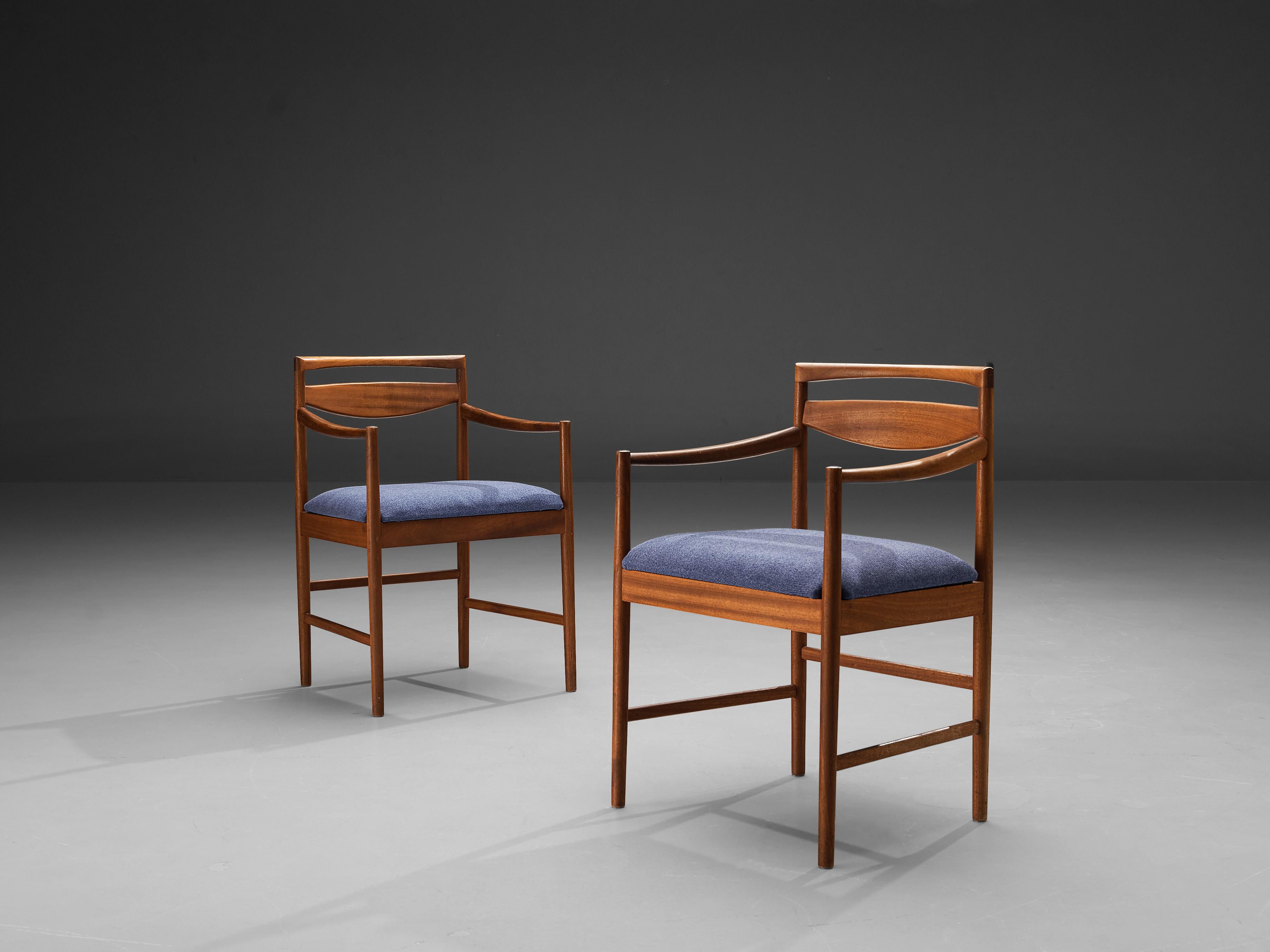 Pair of two armchairs, teak, blue fabric, Denmark, 1960s

Stunning pair of armchairs with striking backrests. The model is angular and modest as it is build up in mainly horizontal and vertical lines. Only the backrest is curved and frames a