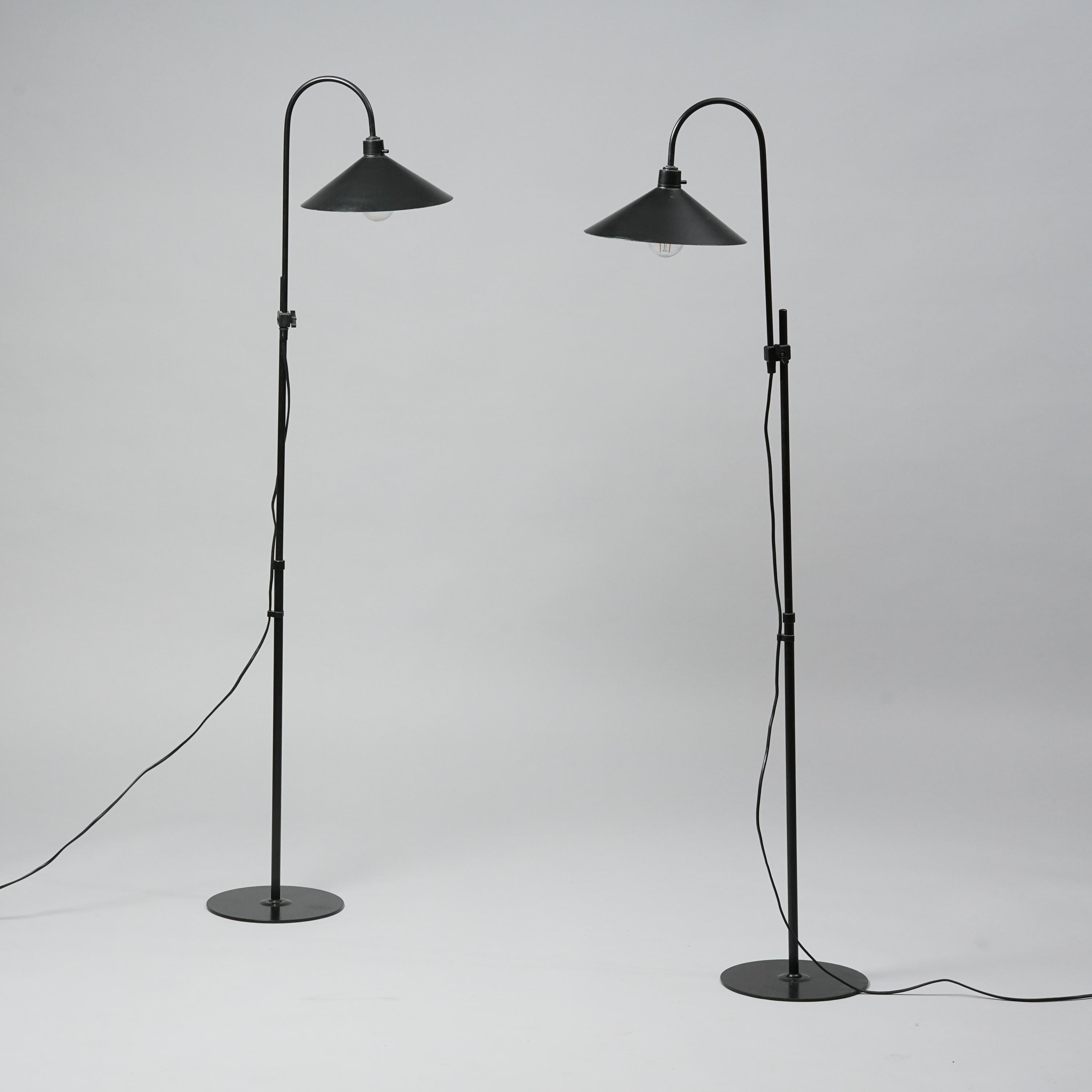 Set of two Danish floor lamps by Frandsen. Metal. Good vintage condition, minor wear consistent with age and use. The floor lamps are sold as a set. The height of the lamps is adjustable. The maximum height is 150 cm. Lampshade diameter is 26 cm.