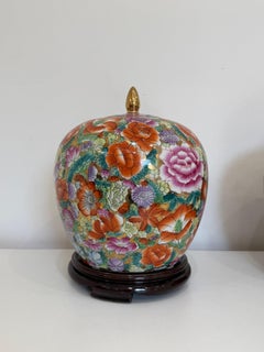 Set of two decorated Chinese porcelain Vases with wooden bases, 1950s