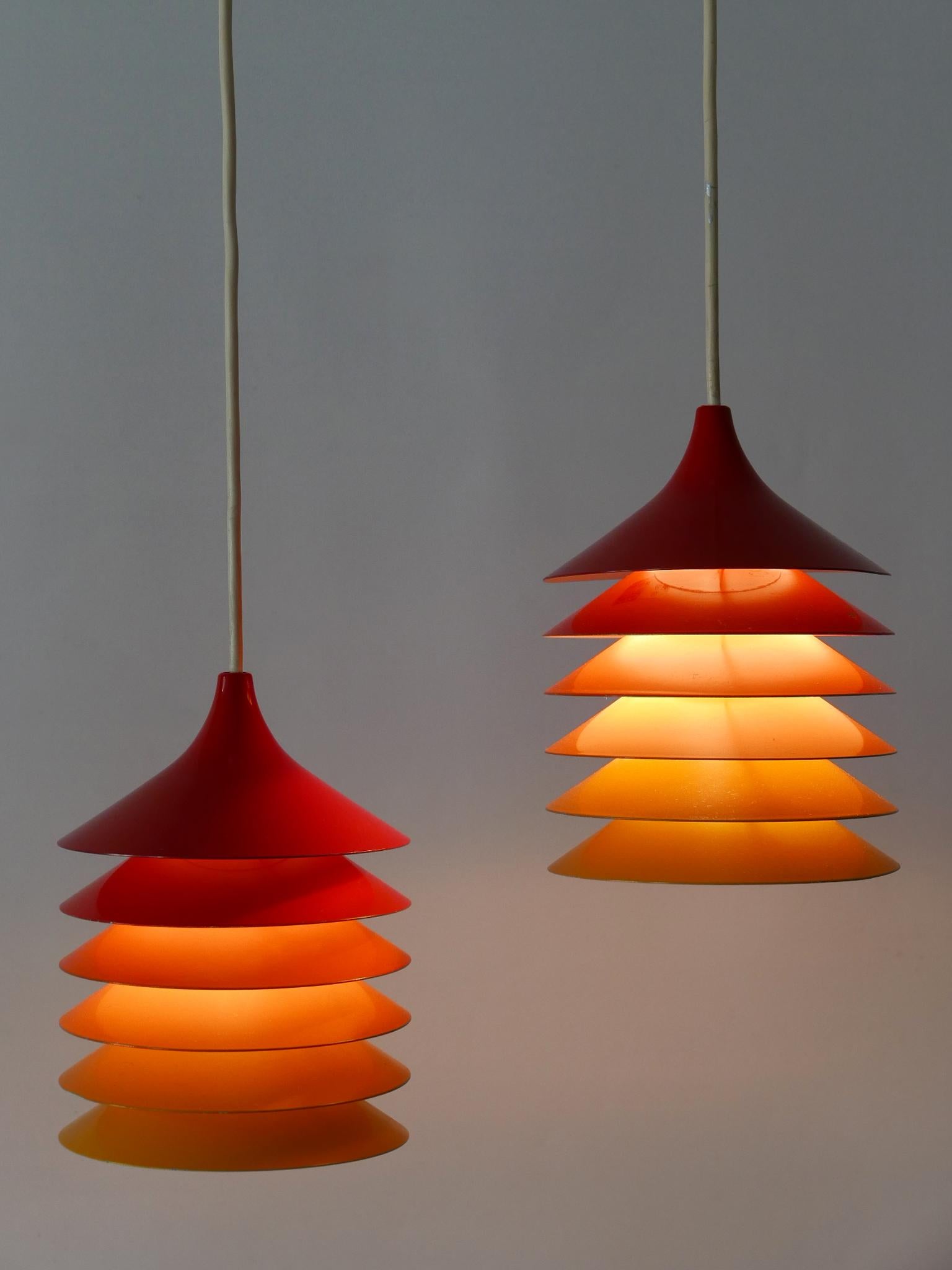 Lovely and highly decorative pendant lamps or hanging lights 'Duett'. Designed by Bent Gantzel Boysen for Ikea, Sweden, 1980s.

Executed in enameled metal, each lamp needs 1 x E14 / E12 Edison screw fit bulb. They are wired, in working condition