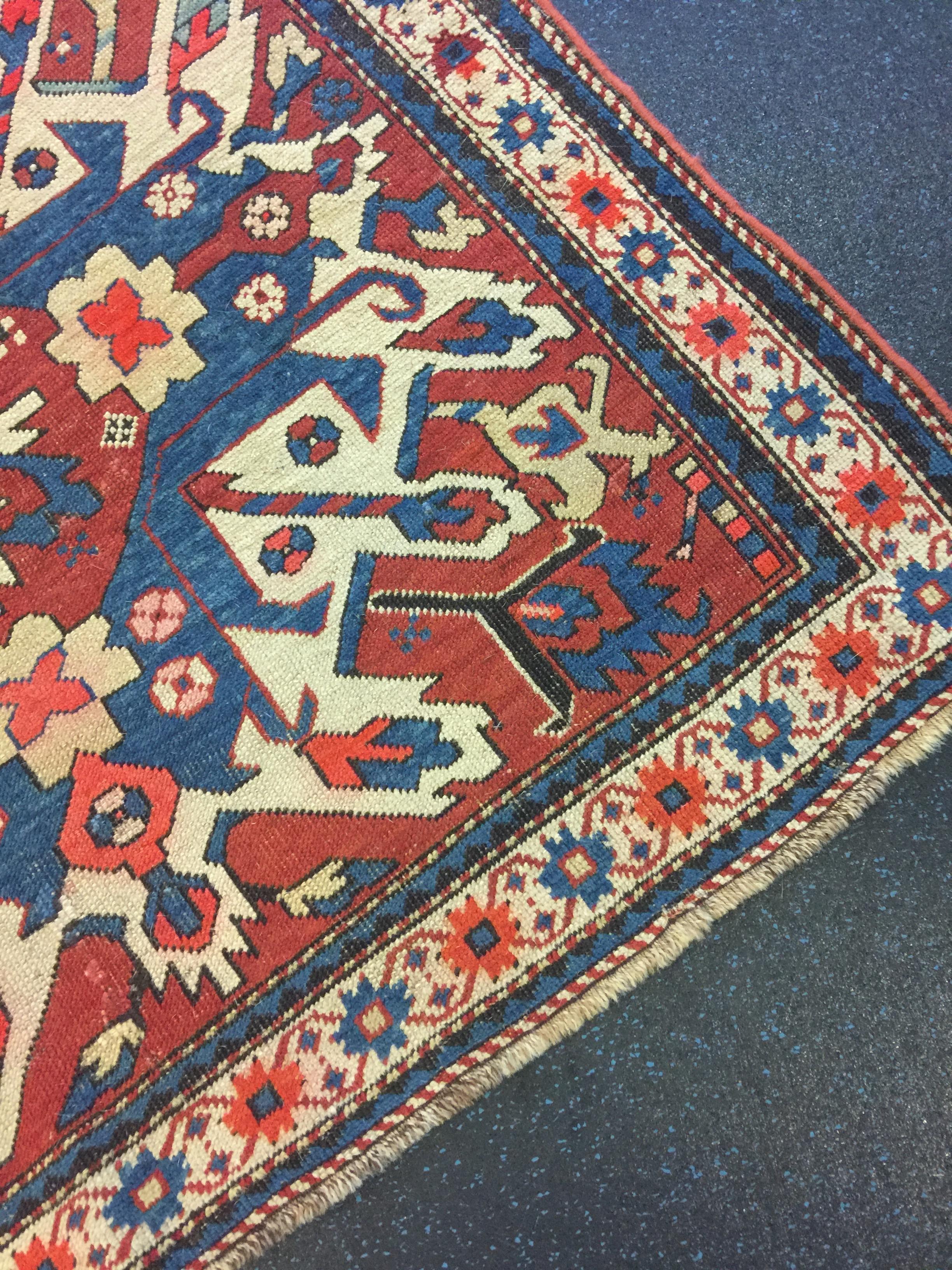 19th century Eagle Kazak Chelaberd wool carpet rugs set (2 rugs), wonderful colors and sunburst detailing. Wool, hand-knotted, vegetable dye colors and many interesting details, circa 1870. Sole collector proprietor acquired in the 1970s in Iran