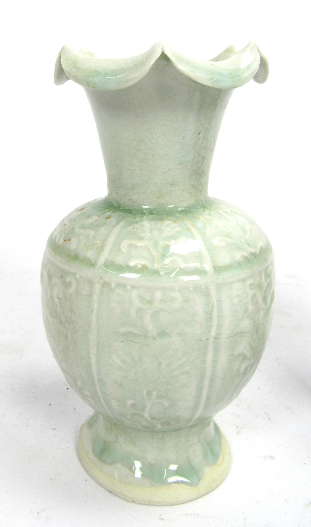 Set of two early 20th century Celadon vases with flared peaked rims.