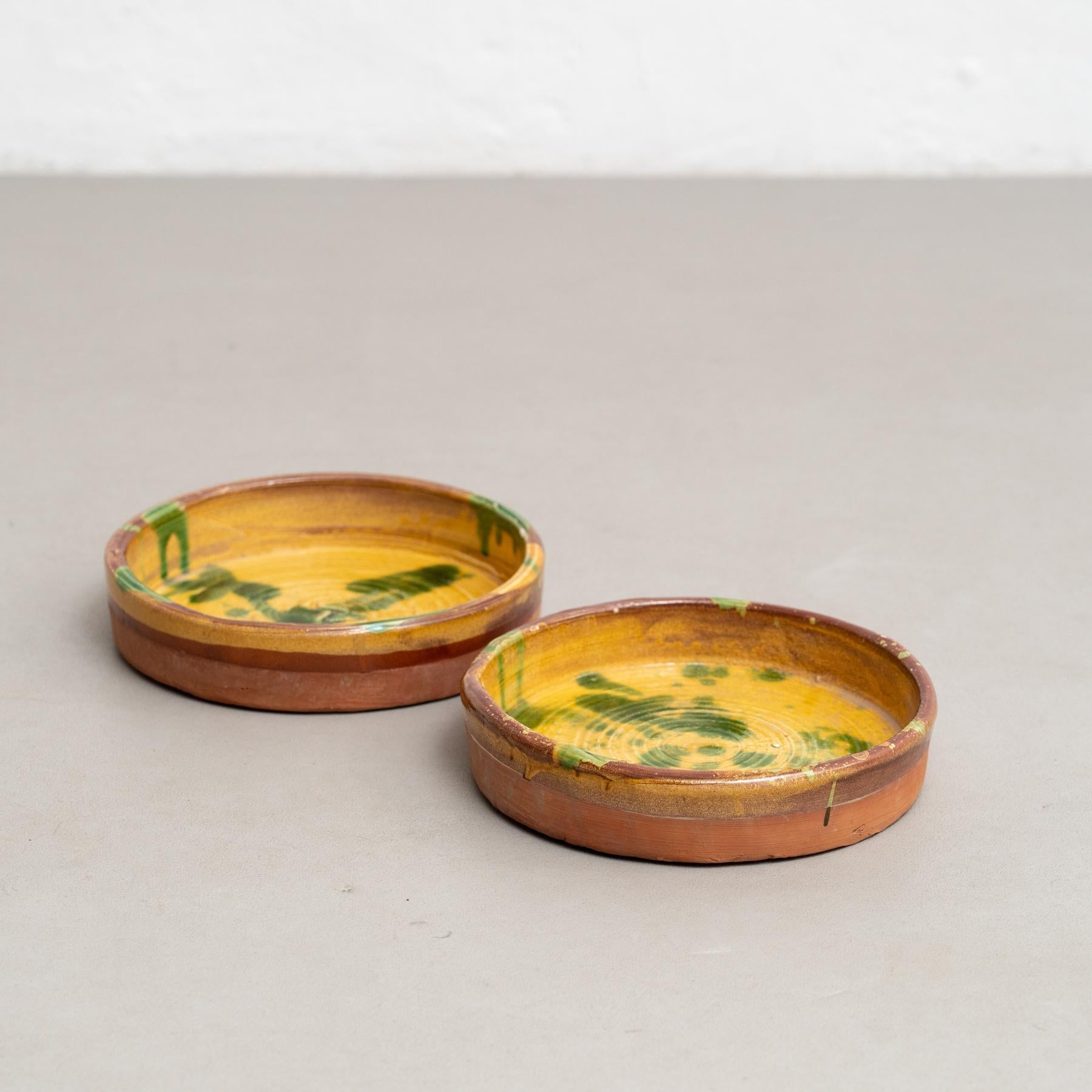 Set of two Early 20th century hand painted rustic popular traditional ceramic.
By unknown artisan, France.
In original condition, with minor wear consistent with age and use, preserving a beautiful patina.

Materials:
Ceramic

Important information