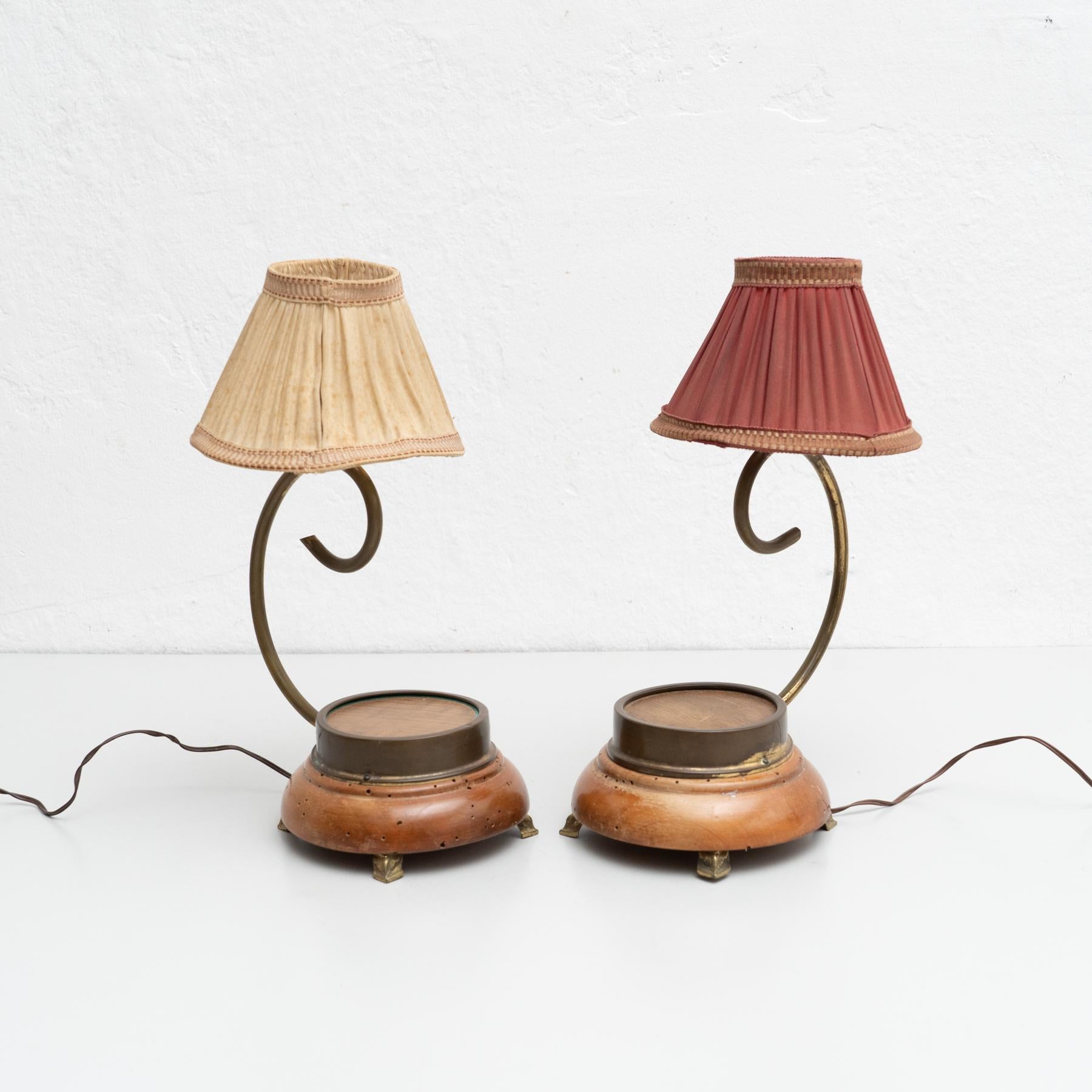 Set of two early 20th century table lamp, with a wooden base and a paper screen.

Manufactured by unknown designer in Spain.

In original condition, with minor wear consistent with age and use, preserving a beautiful