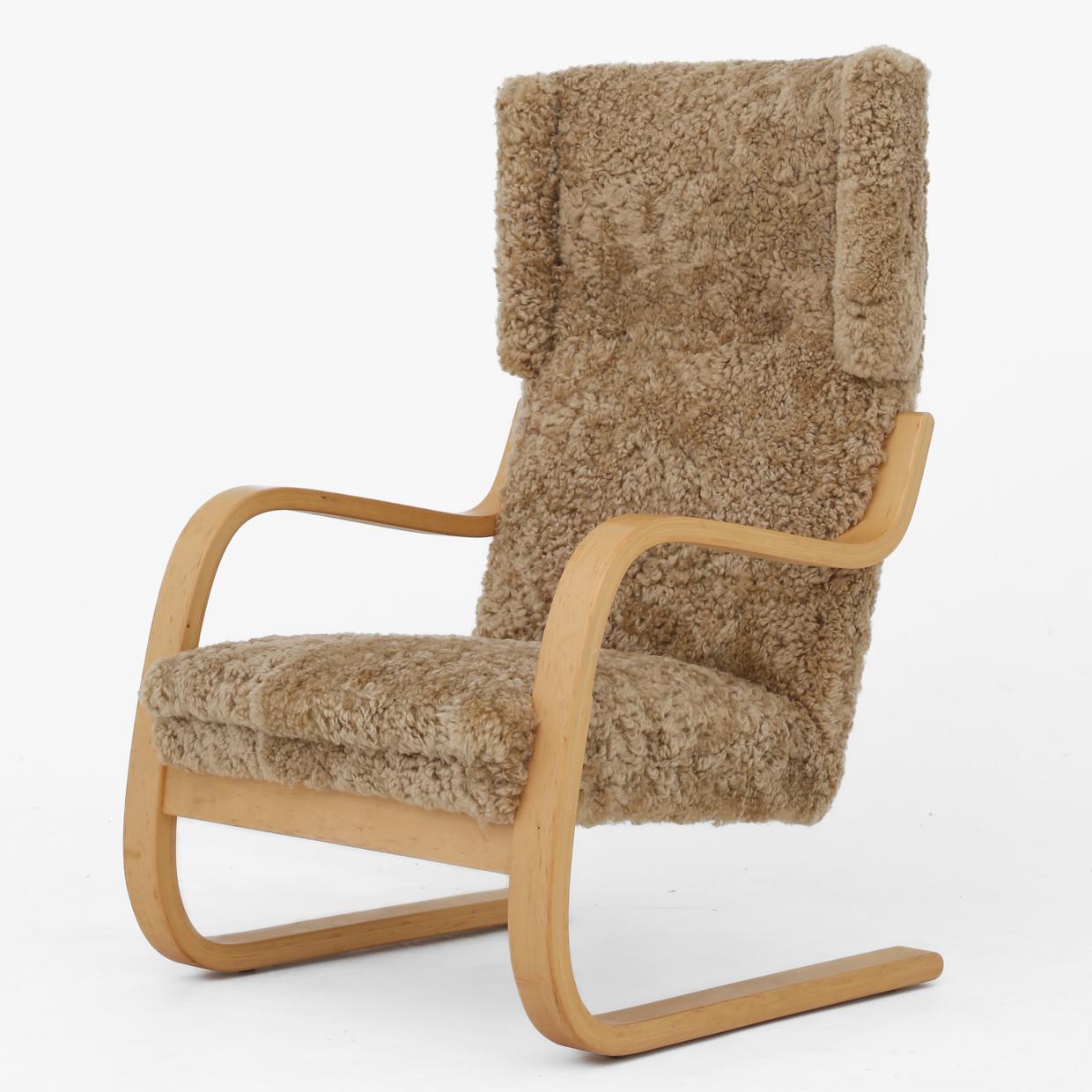 Set of two Model 401 - easy chairs in birch wood, reupholstered in 'Honey' lambskin. Alvar Aalto / Artek.