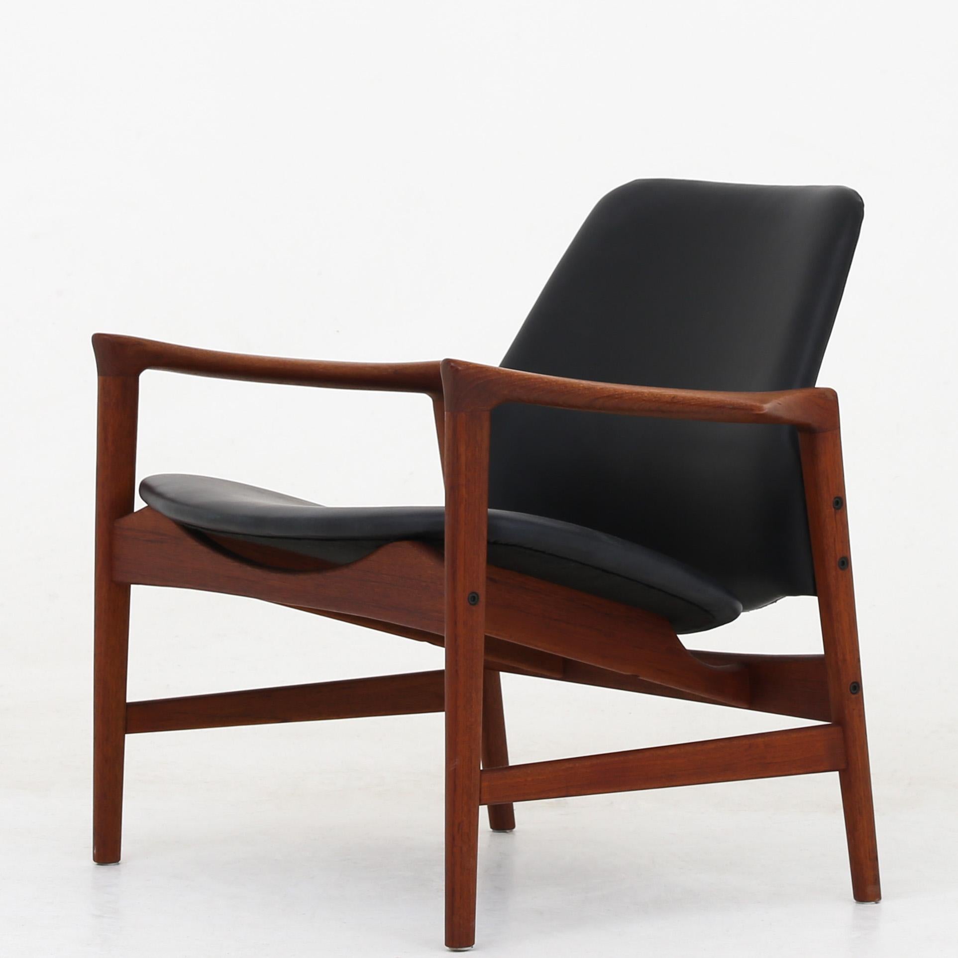 Ib Kofod Larsen set of two easy chair in teak with black leather. Model 'Holte'. Maker Oluf Persson OPE.