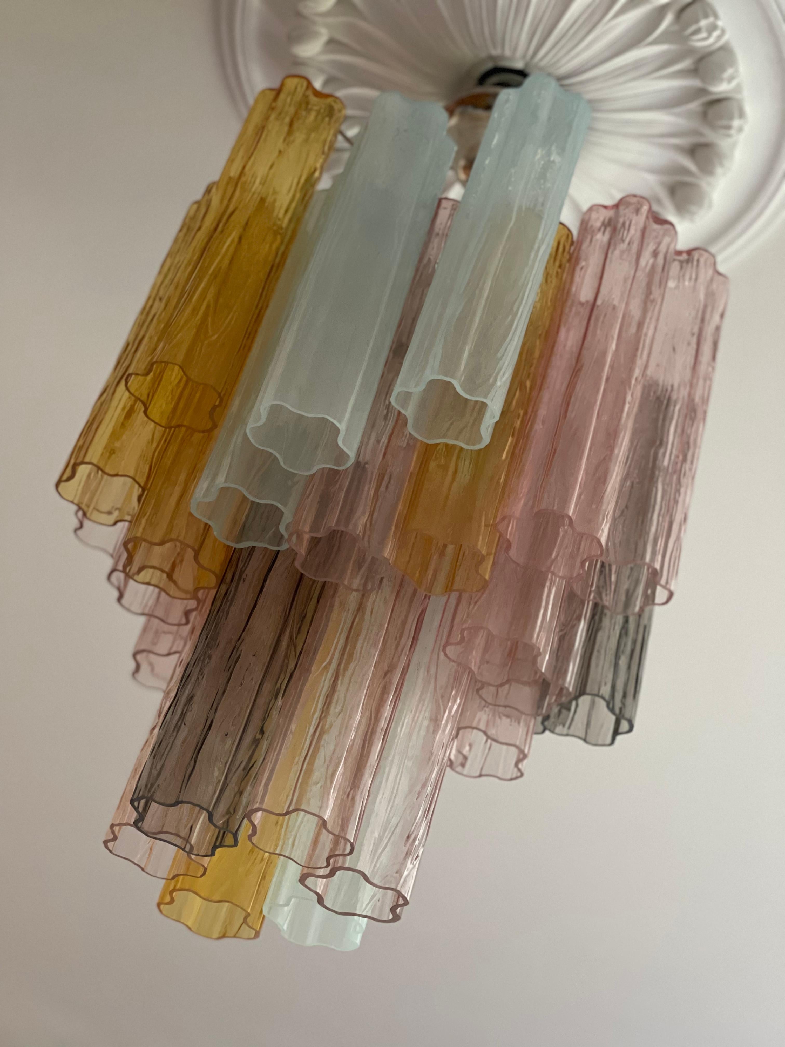 Pair of Stunner, Bold and Eclectic Colorful Murano Chandeliers with Tubular Glass Prisms.  Contemporary Chandeliers in Traditional Italian Mid-Century Style.
Every chandelier is composed of 30 Colored Crystal Elements in the size of 30 x7 cm (11.8
