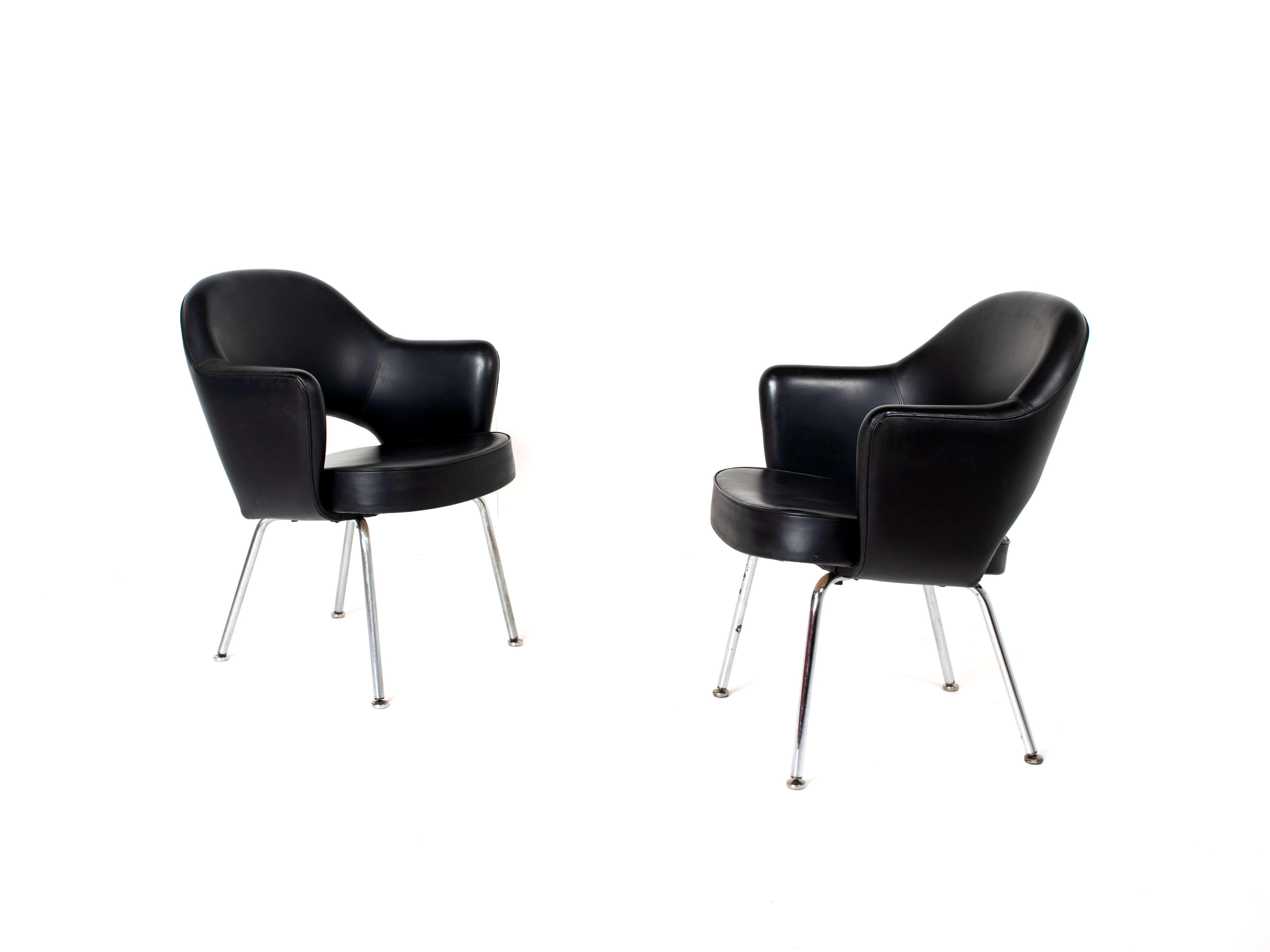 Black leather upholstery with chrome / nickel tubular legs, finished with round feet. Both chairs are in good condition; one chair has a small dent in the leather as per picture. The feet underneath the legs can be used to adjust the chair. One