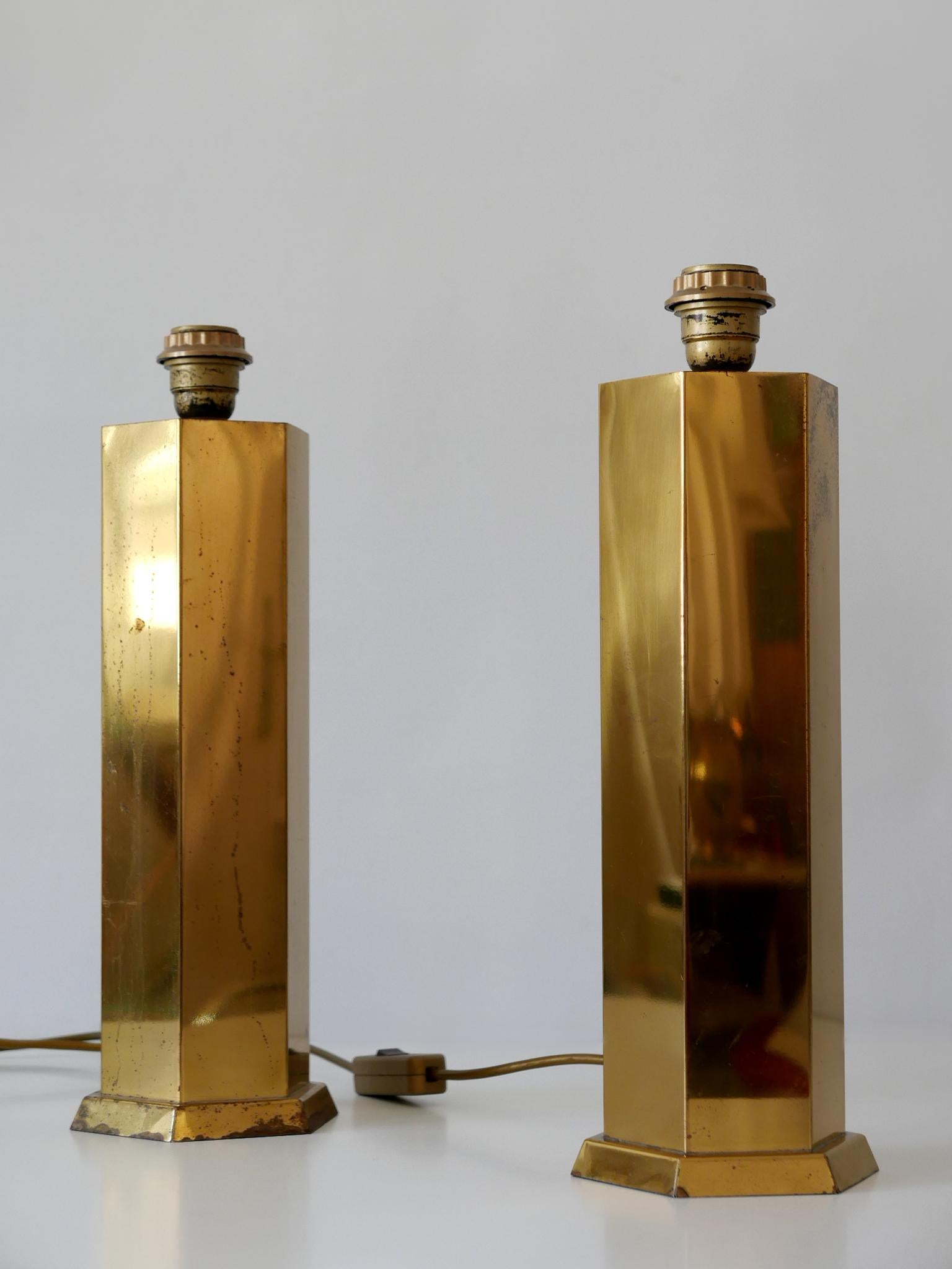 Set of two rare Mid-Century Modern brass table lamps. Designed and manufactured in Germany, 1950s.

Executed in brass, each lamp comes with an E27 / E26 Edison screw fit bulb socket, is in working condition and runs both on 110 and 230