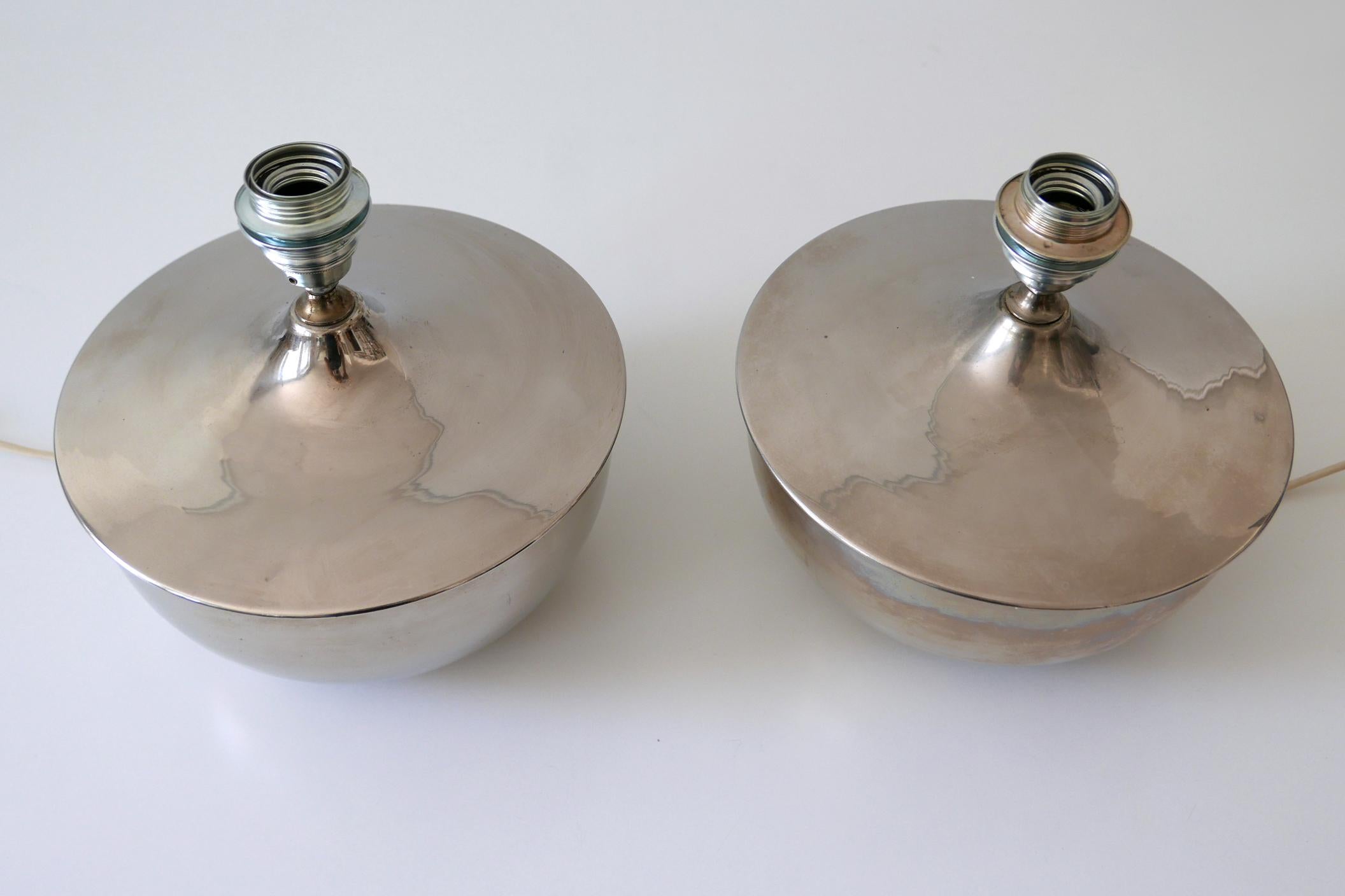 Set of two rare and beautiful Mid-Century Modern table lamps. Manufactured in Germany, 1970s.

Executed in nickel-plated brass, each lamp comes with 1 x E27 / E26 Edison screw fit bulb holder, is wired, in working condition and runs both on 110 /