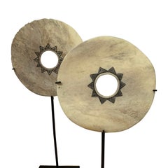 Set of Two Engraved White Bone Discs on Stands, Indonesia, Contemporary