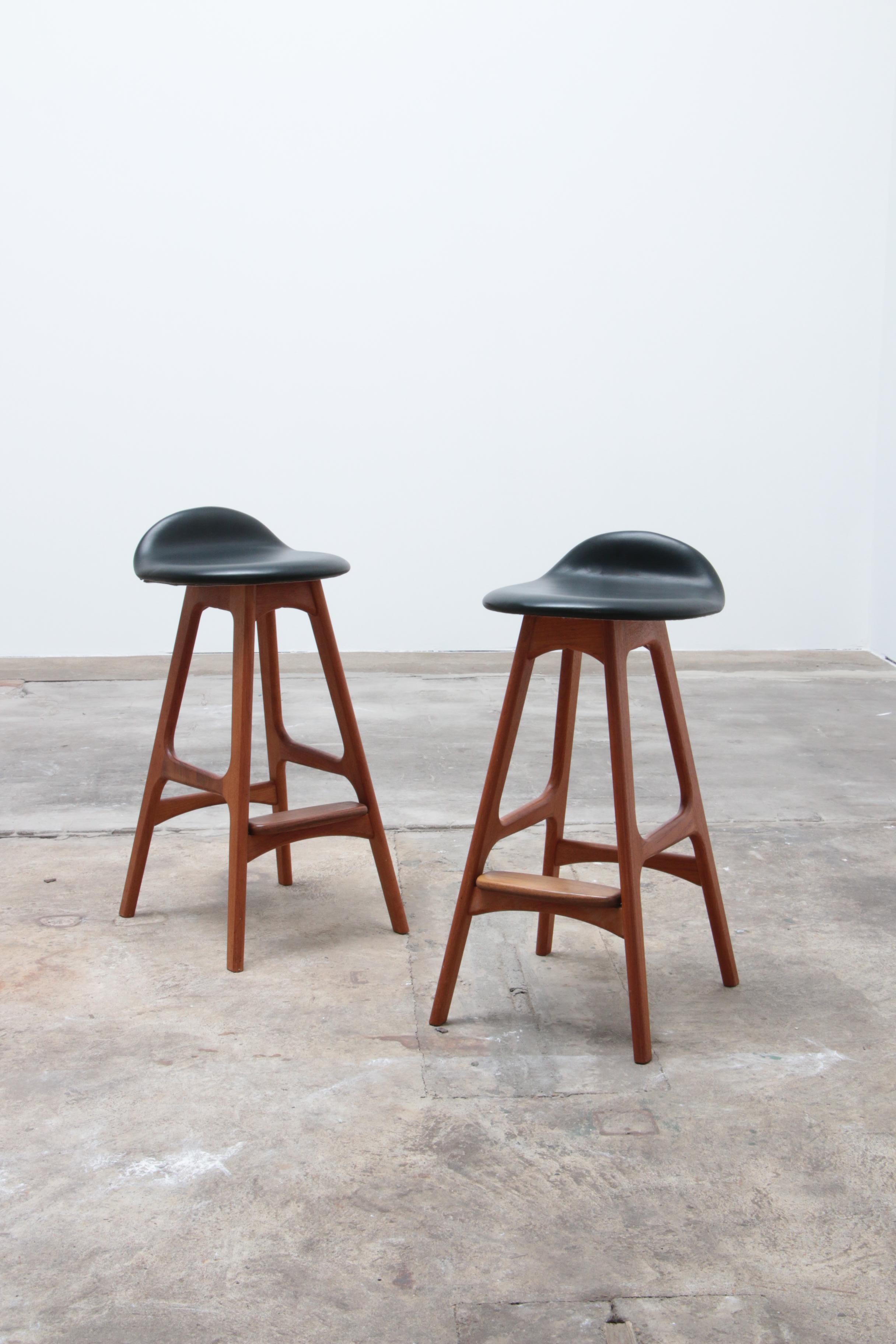 This set of 2 bar stools was designed by Erik Buch and produced by O.D. Mobler in Denmark.

There is a label from the manufacturer.

In our opinion, this is the most elegant, practical, comfortable and most beautiful bar stool ever made.

The