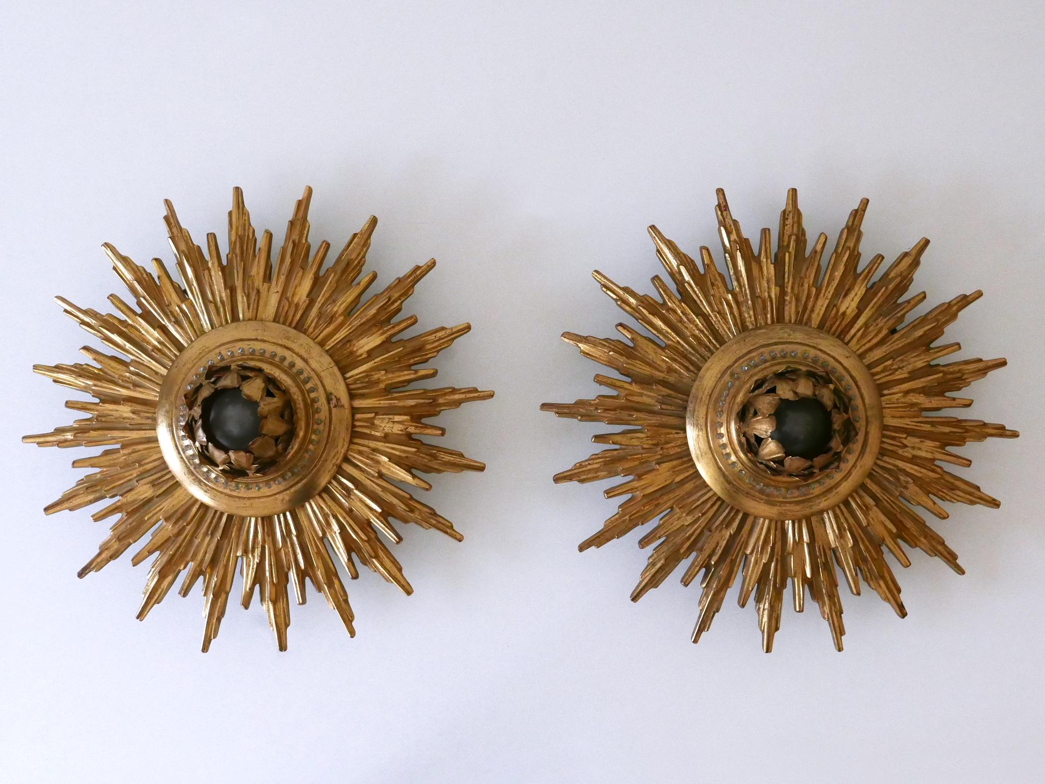 Extremely rare, large and highly decorative gilt flush mounts or sconces. Designed and manufactured probably in Germany, 1950s.

Executed in gilt metal and plastic, each light comes with 1 x E27 / E26 Edison screw fit bulb holder, is wired and in