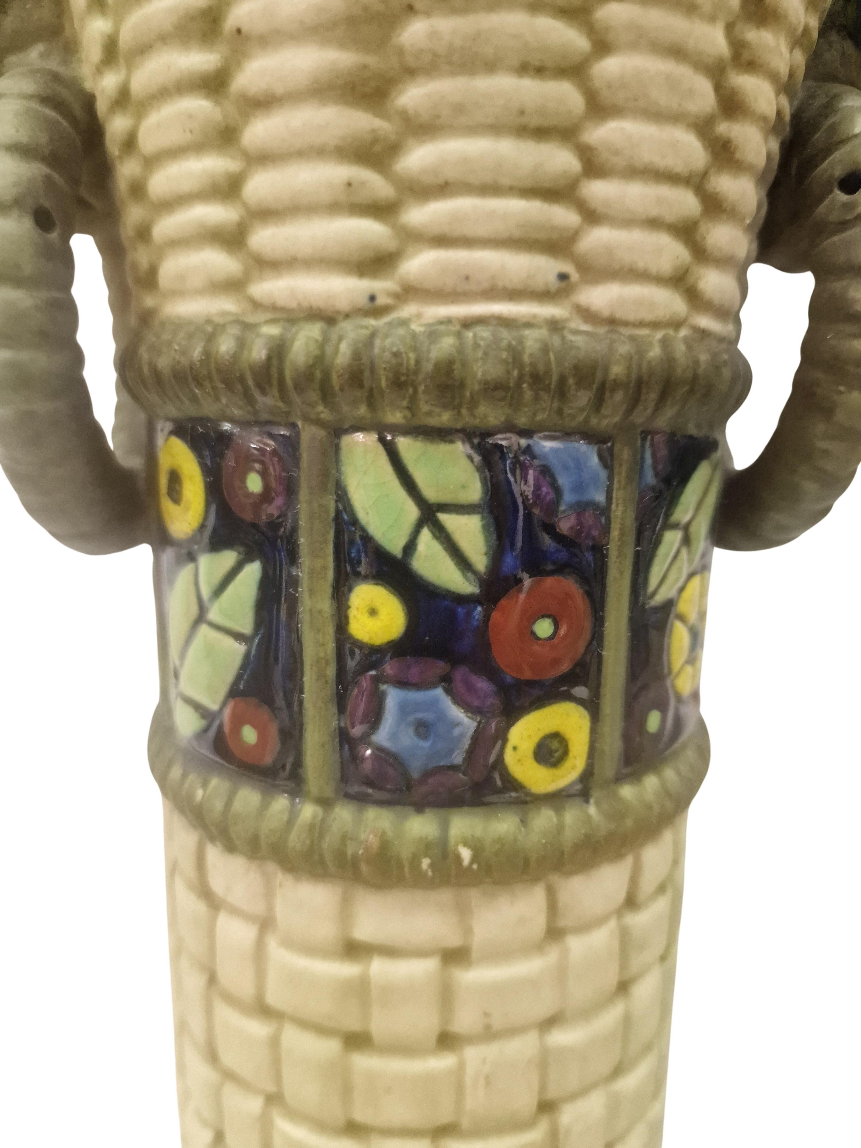 Exceptional set of two vases, so-called basket vases, made from 1910 - 20, by the famous Amphora factory in Bohemia.

The vases have a round base and taper towards the top. They have a slim shape and open upwards. The vases have two round handles on