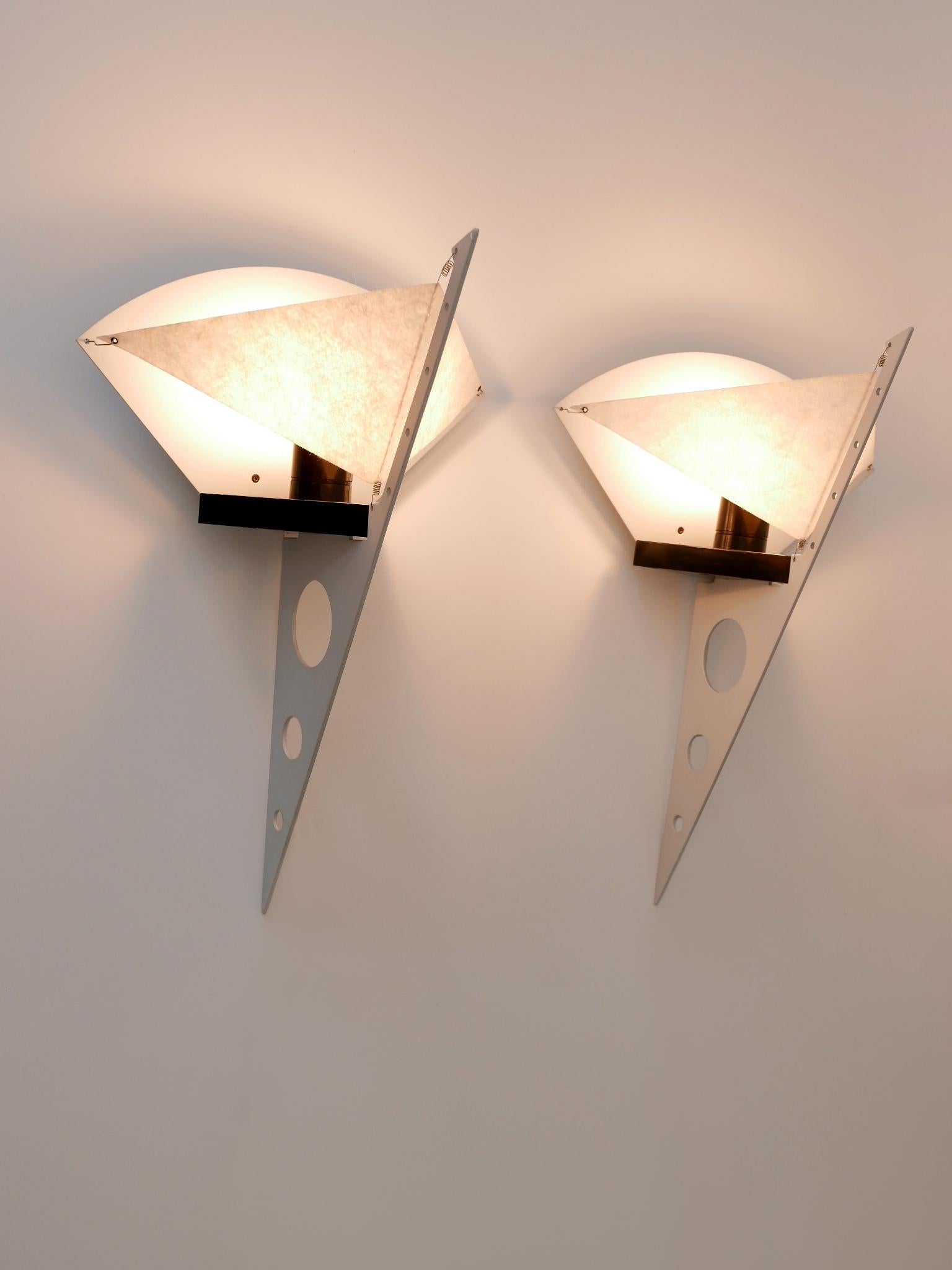Set of two amazing Post-Modern sconces or candle holders 'Filicudara'. Designed by Steven Lombardi for Artemide, Italy, 1980s. Makers mark on each sconce.

Each of the sconces will be delivered with the matching part to use them as wall candle
