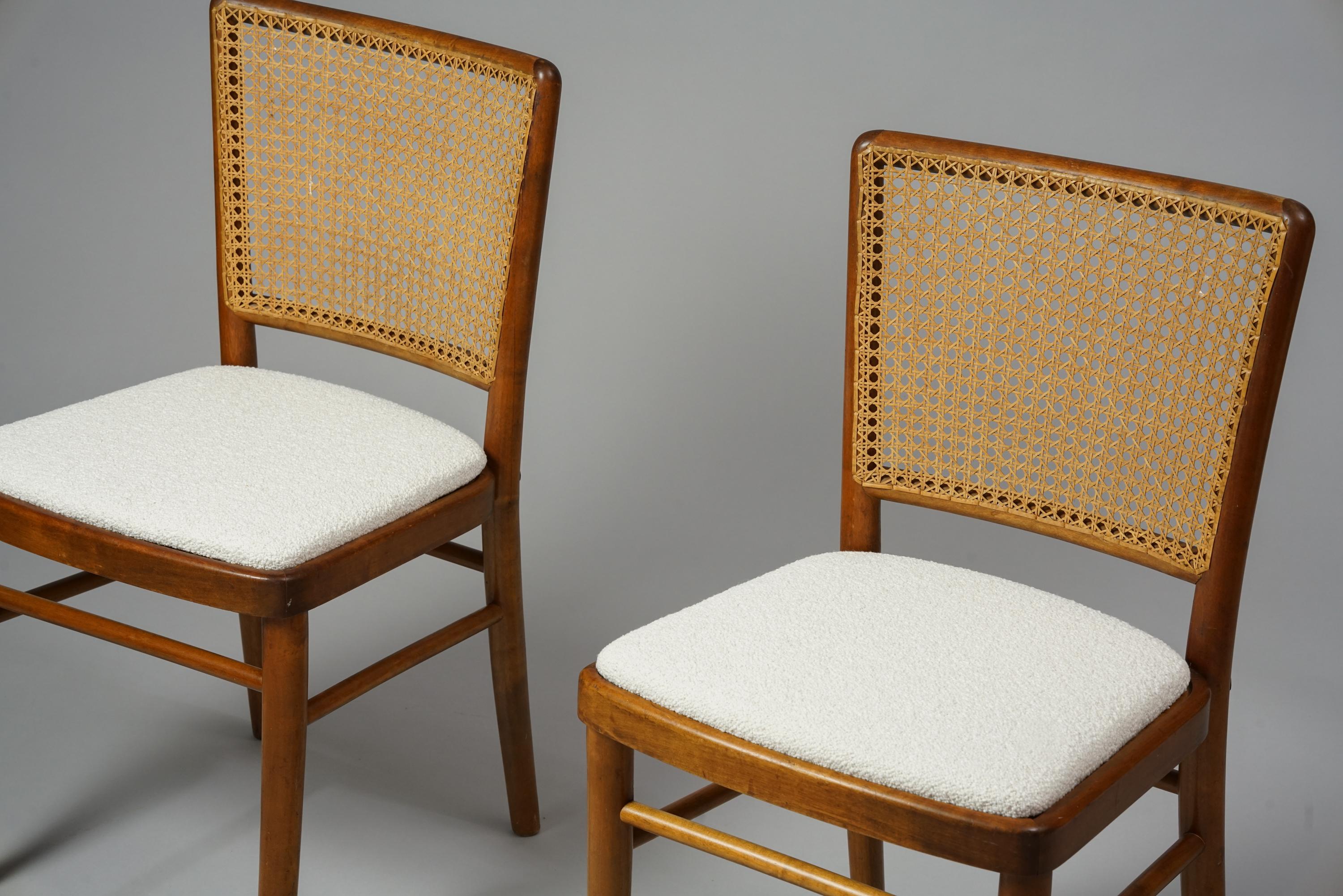 Scandinavian Modern set of two rattan & birch chairs from the 1940s/1950s, produced by Wilhelm Schauman and attributed to Werner West. Birch frame, rattan backrest, re-upholstered with with high quality Lauritzon´s Orsetto fabric. Good vintage