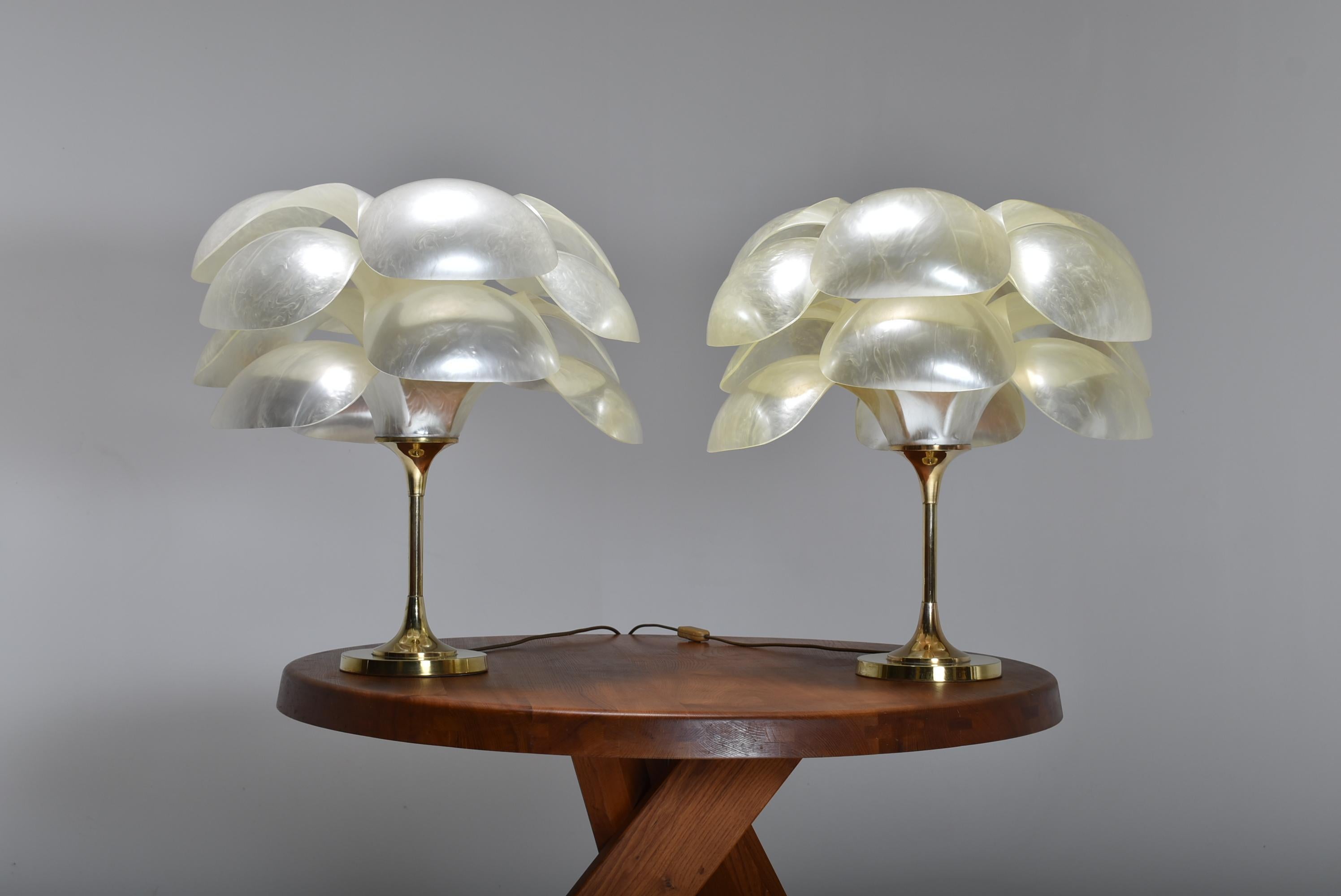 Rare set of two table lamps by Maison Rougier.
The big opalescent petals diffuse beautiful and soft light.
The lamps have a clear presence, and do not even need to be lighted, as one can see by the pictures.
This model is quite rare, and a pair