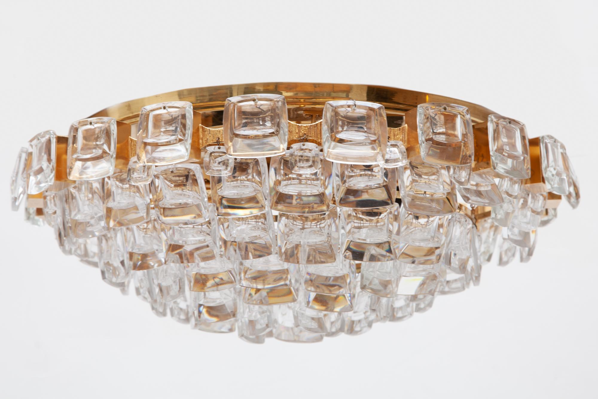Vintage chandelier by Palme and Walter, Palwa, Germany, 1970s.
A beautiful Hollywood Regency flush mount made of gold-plated brass and square lens glasses. 

Five tiers of soft square glass crystals. Lit by 5 bulbs.Dimensions 48 W x 15 H x 48 D cm 