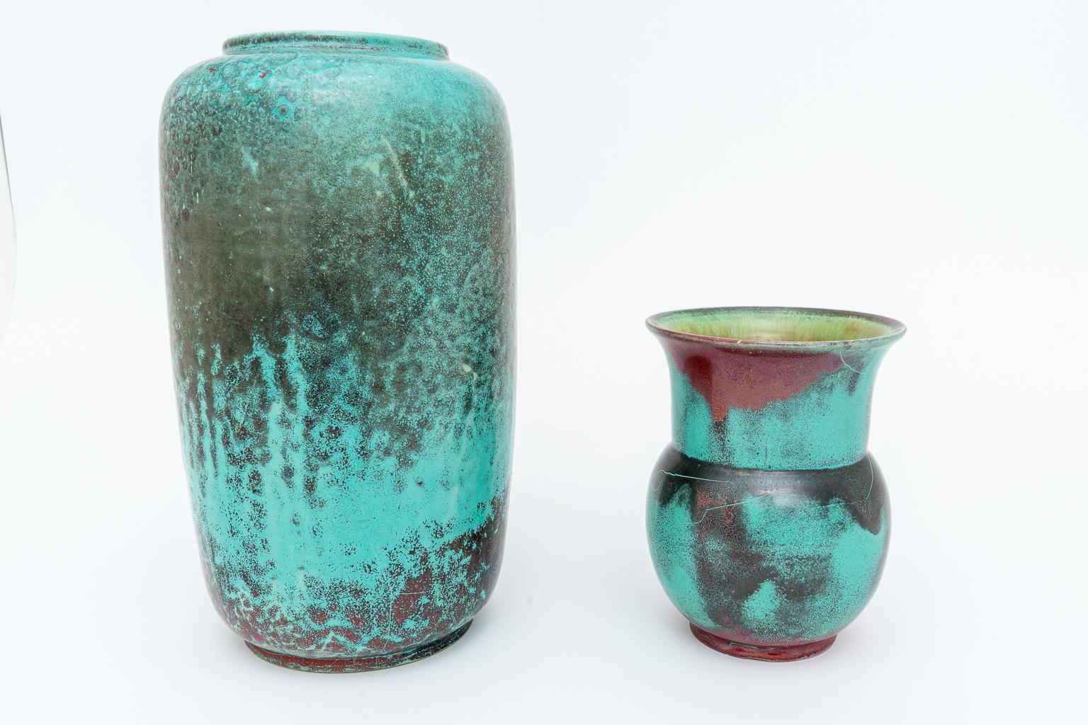 This stylish set of glazed pottery urns were created by the artist Richard Uhlemeyer in the late 1940s and they were acquired from a Palm Beach estate.

The glazes take on a molten, oxidized metallic look and finish of bronze and copper.

Note: