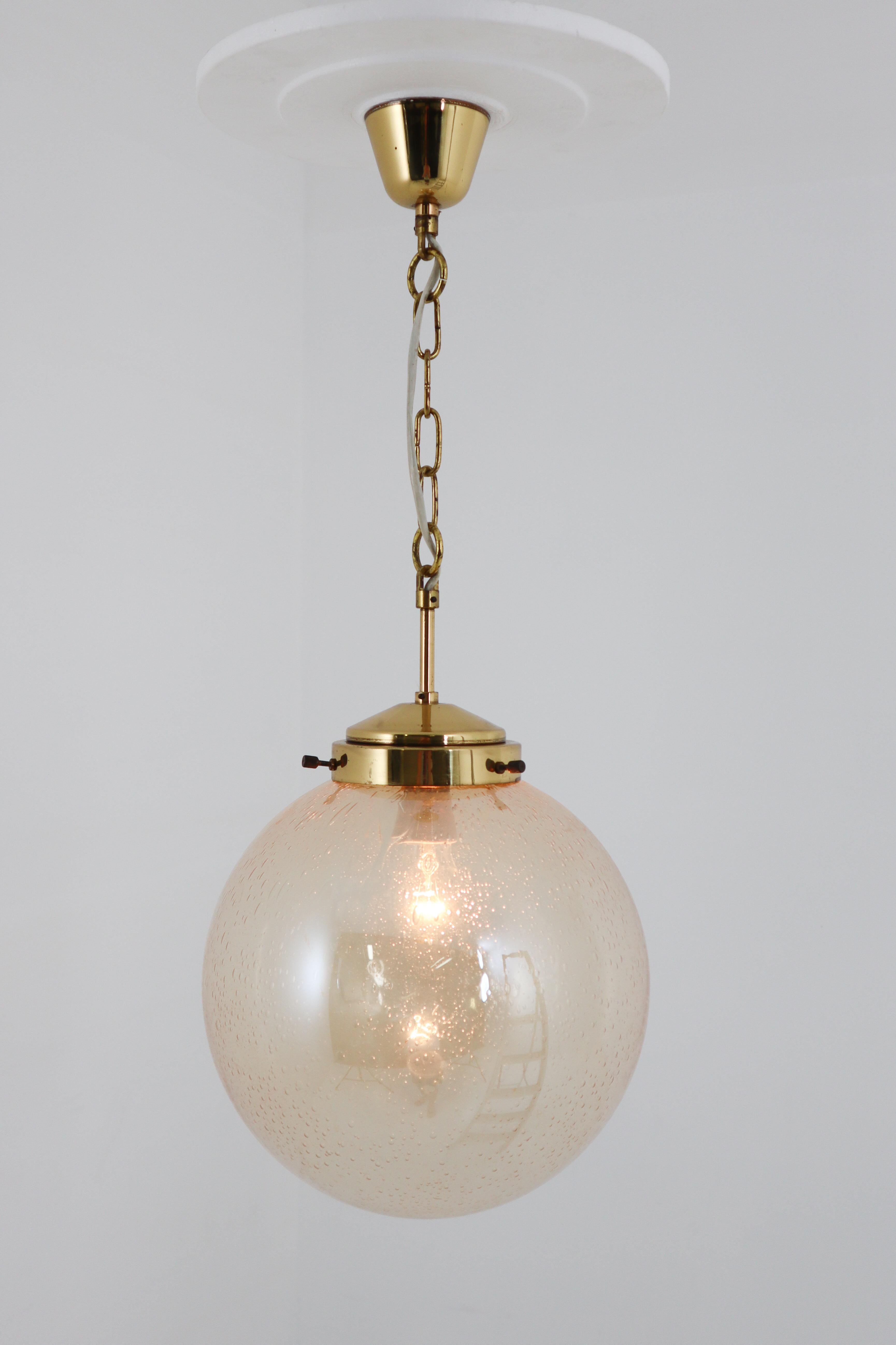 German Set of Two Globe Pendant Lights, Brass and Smoked Glass, 1970s For Sale